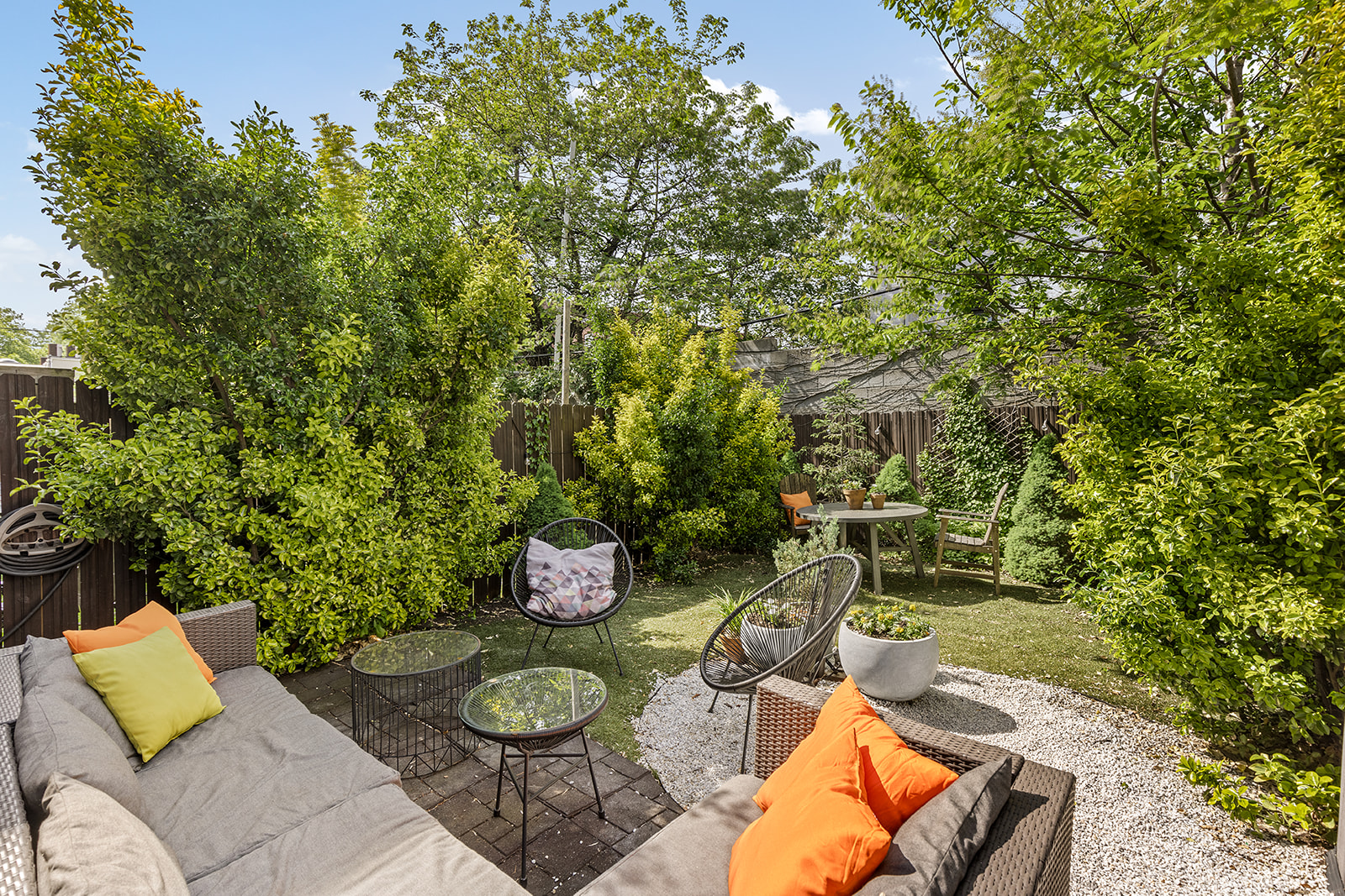 495 Rutland Road, Unit 1 Brooklyn, NY 11203 - Photo 2 of 13 a backyard of a house with couches and wooden fence