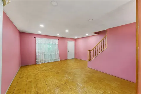 a view of an empty room with windows