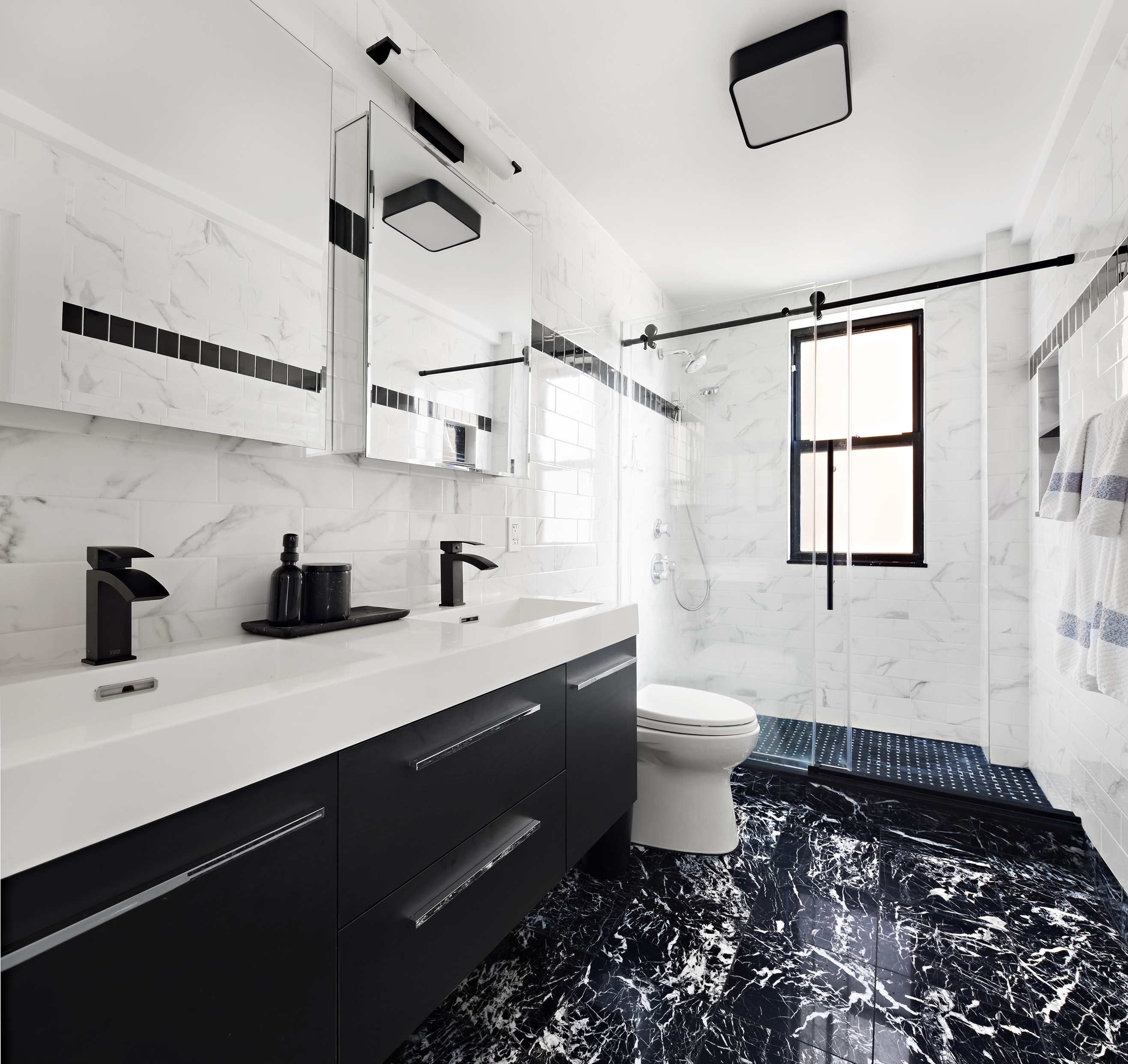 175 West 93rd Street, Unit 10C Manhattan, NY 10025 - Photo 7 of 16 a bathroom with a double vanity sink toilet and shower