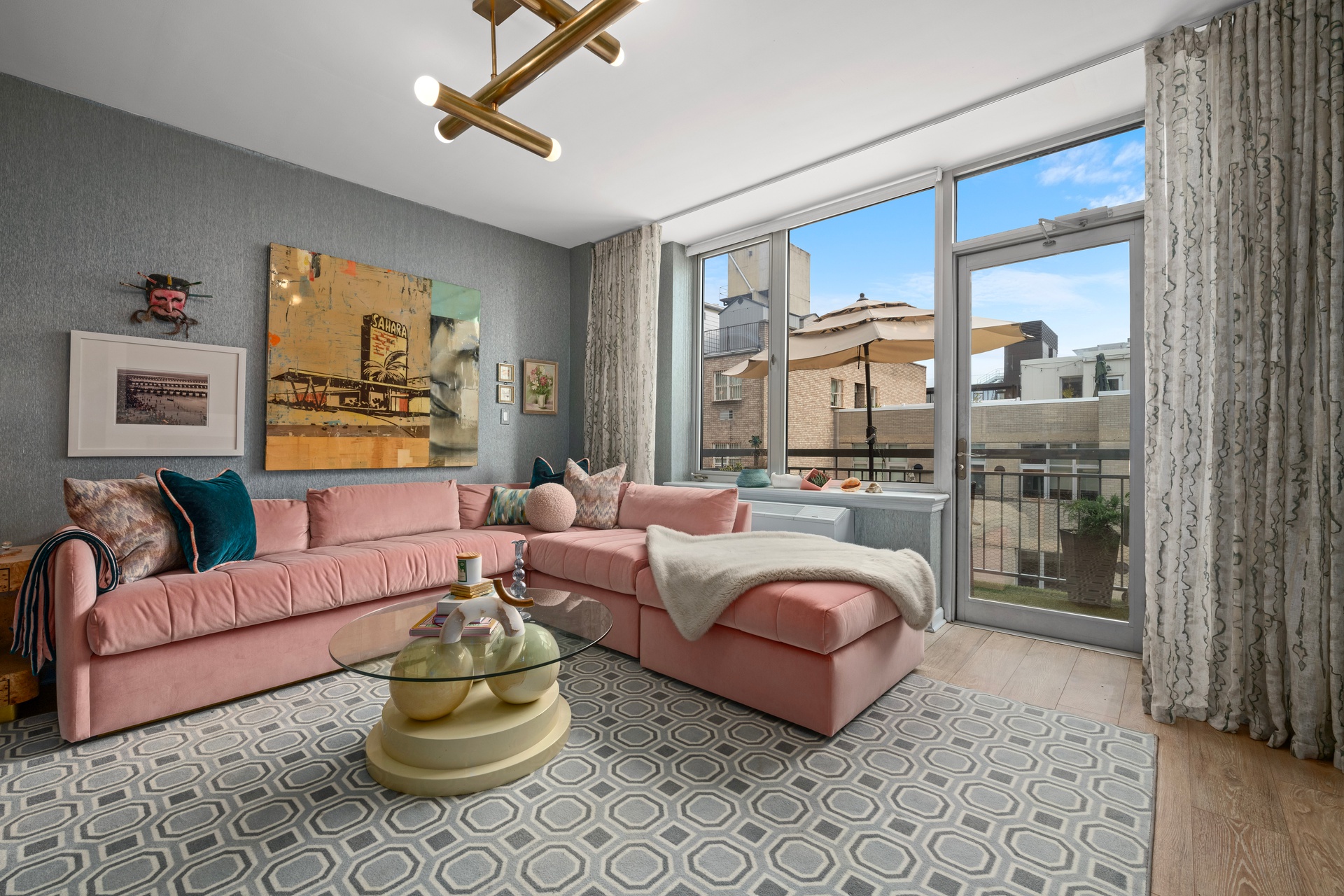 26 Broadway, Unit 602 Brooklyn, NY 11249 - Photo 3 of 12 a living room with furniture and a floor to ceiling window