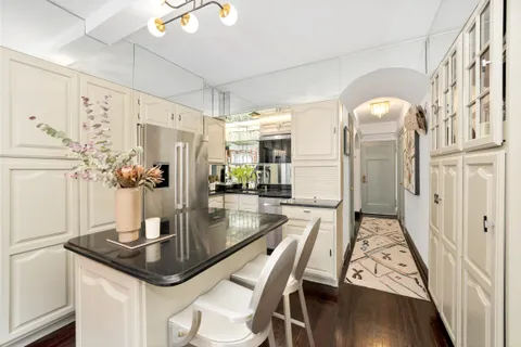 a kitchen with a table and chairs