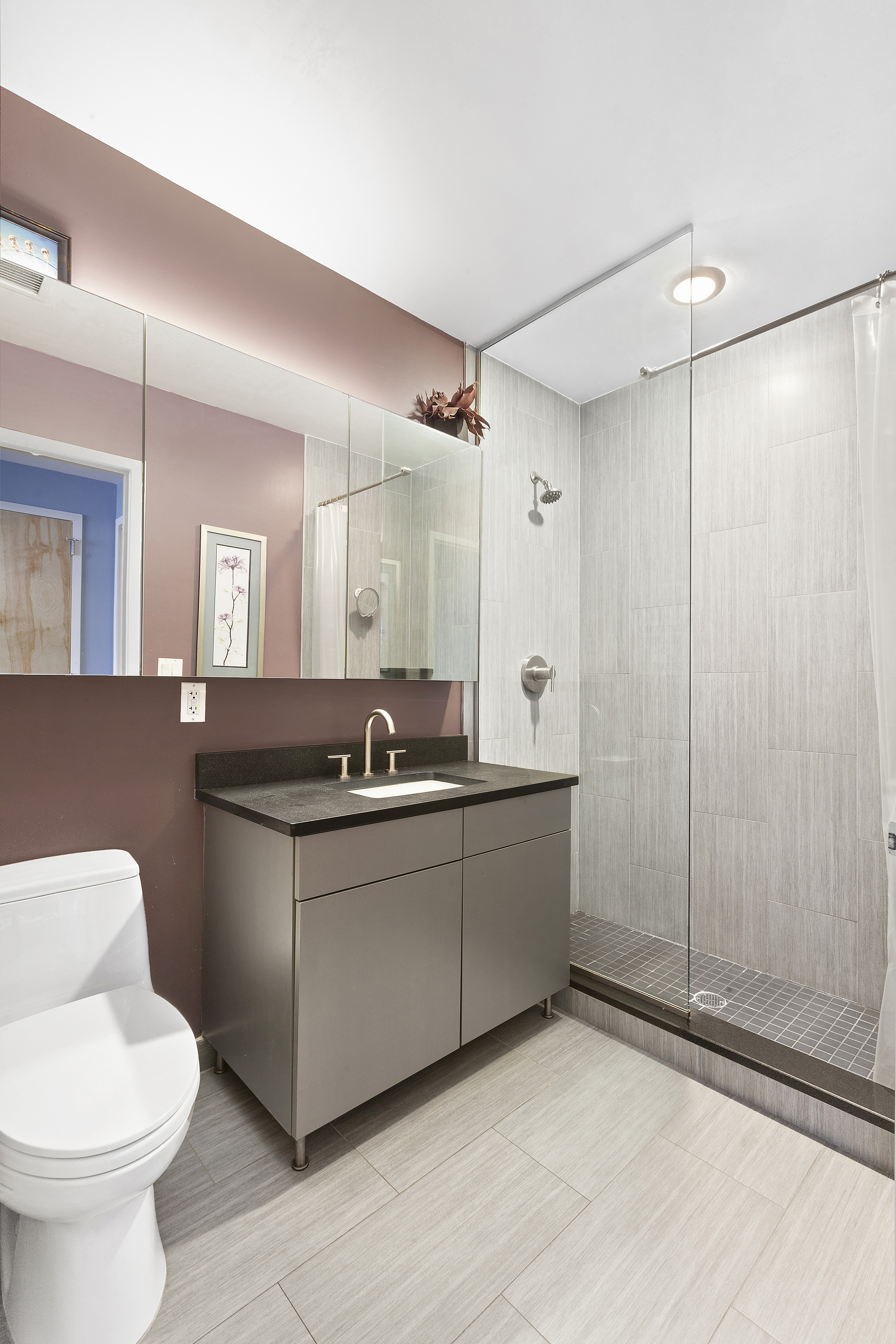 1595 Lexington Avenue, Unit 6E Manhattan, NY 10029 - Photo 6 of 13 a bathroom with a sink toilet and shower