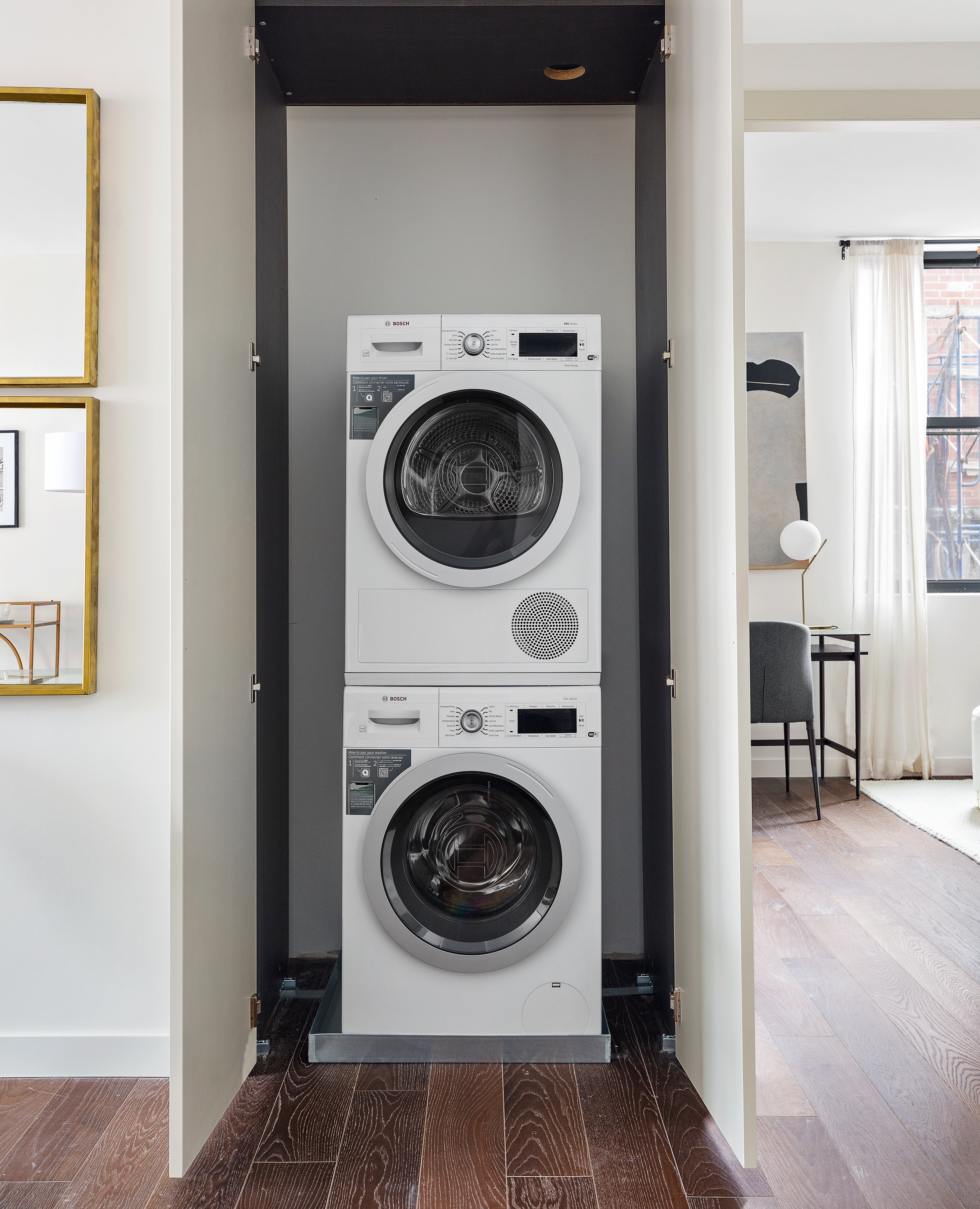 302 East 96th Street, Unit PH6 Manhattan, NY 10128 - Photo 12 of 13 a utility room with dryer and washer