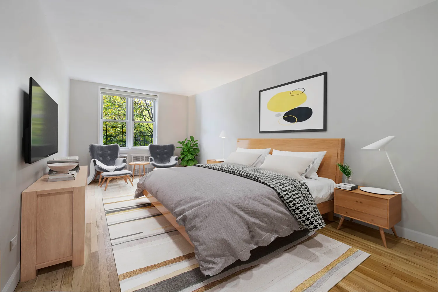 a bedroom with a bed and a tv