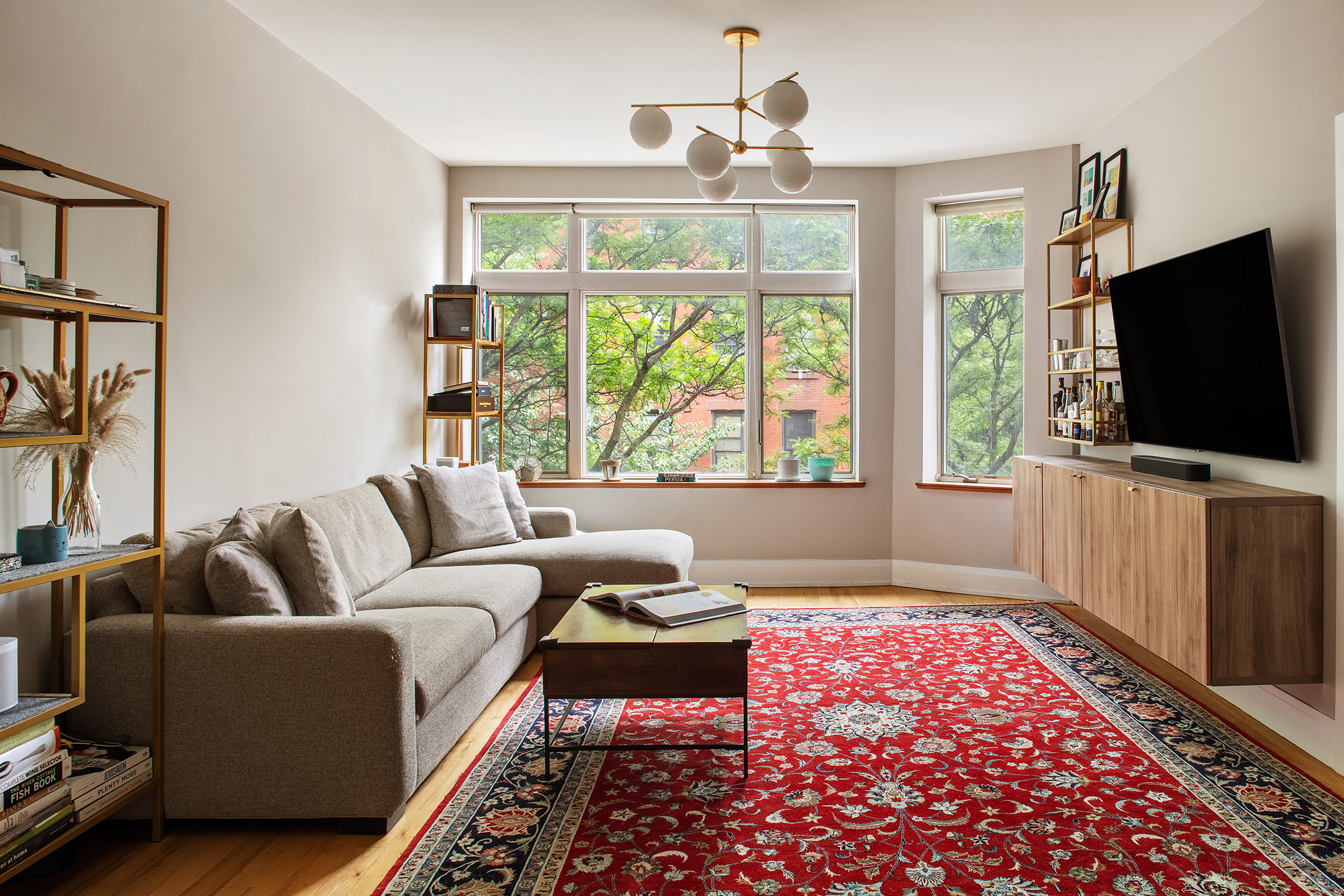 a living room with furniture and a flat screen tv