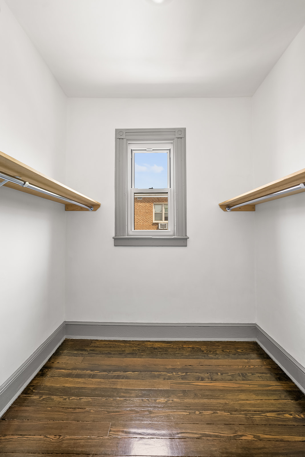 59-45 Palmetto Street Queens, NY 11385 - Photo 15 of 25 a view of a room with wooden floor and window