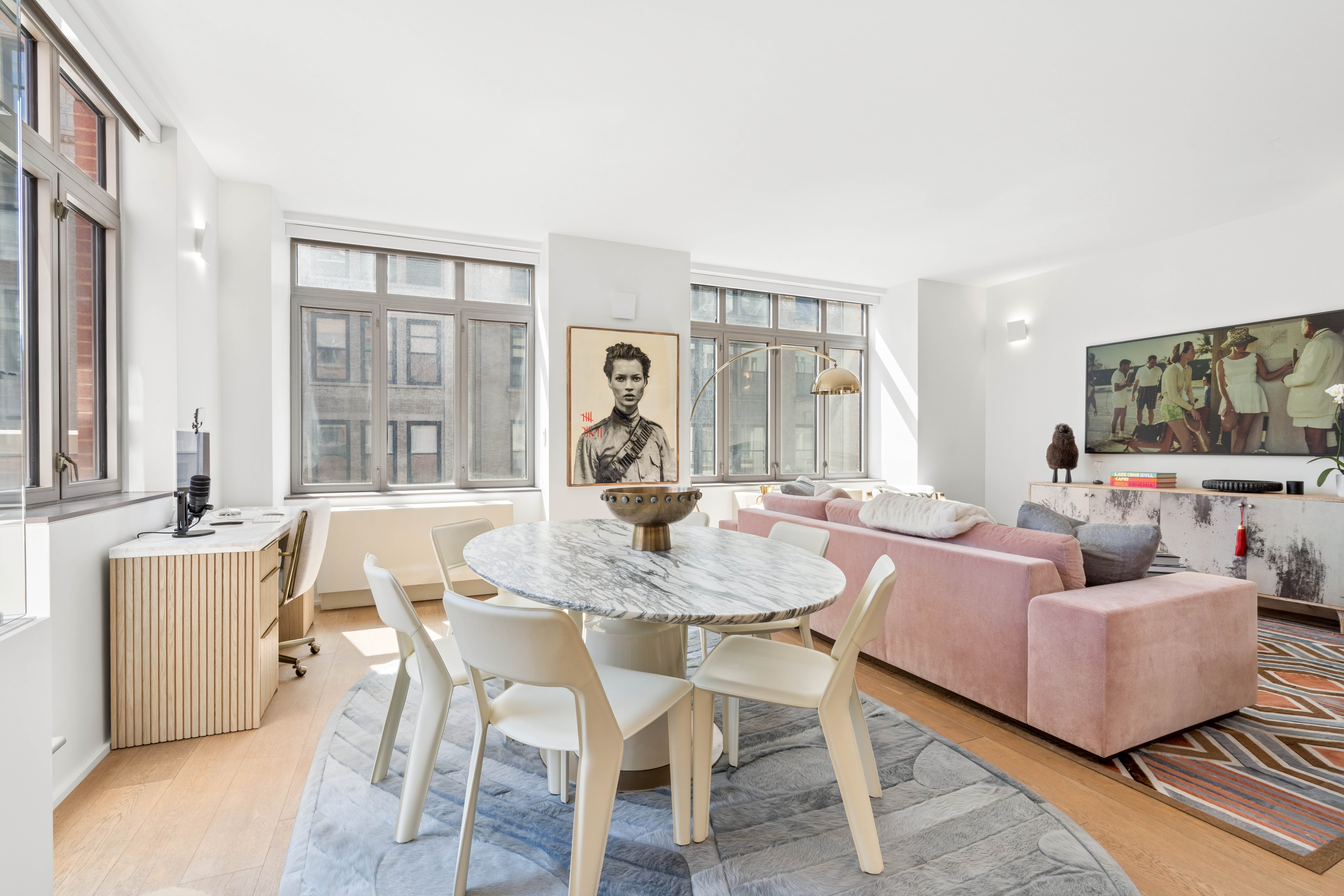 125 West 22nd Street, Unit 10A Manhattan, NY 10011 - Photo 4 of 11 a view of a dining room with furniture and wooden floor