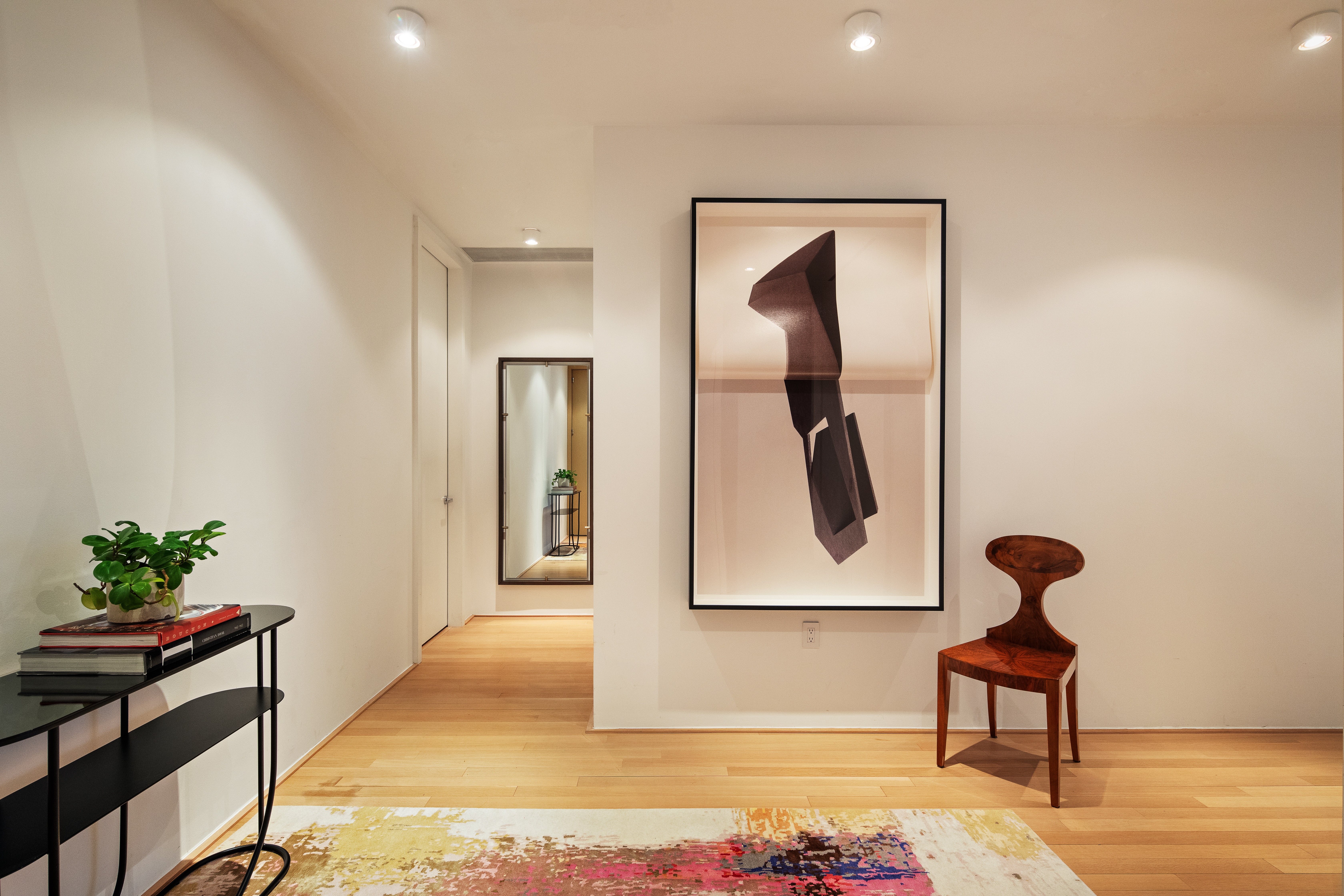 56 Leonard Street, Unit 21AWEST Manhattan, NY 10013 - Photo 9 of 11 a room with painting and a table