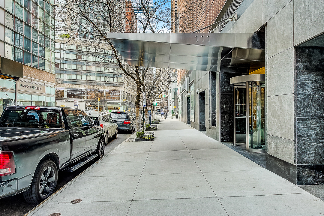 111 West 67th Street, Unit 24K Manhattan, NY 10023 - Photo 4 of 6 a view of a cars park in front of a building
