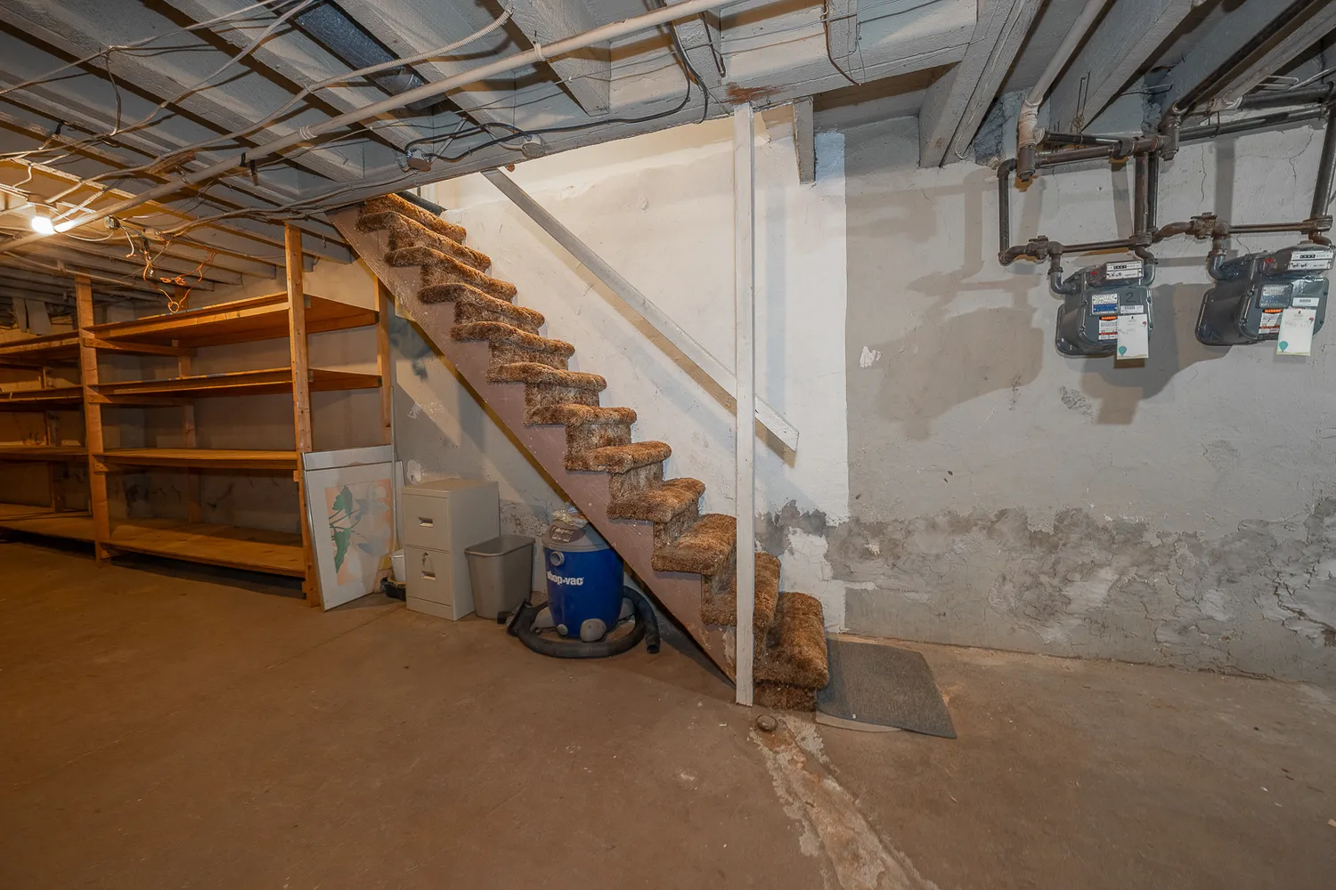 a view of a room with wooden walls