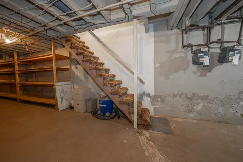 a view of a room with wooden walls