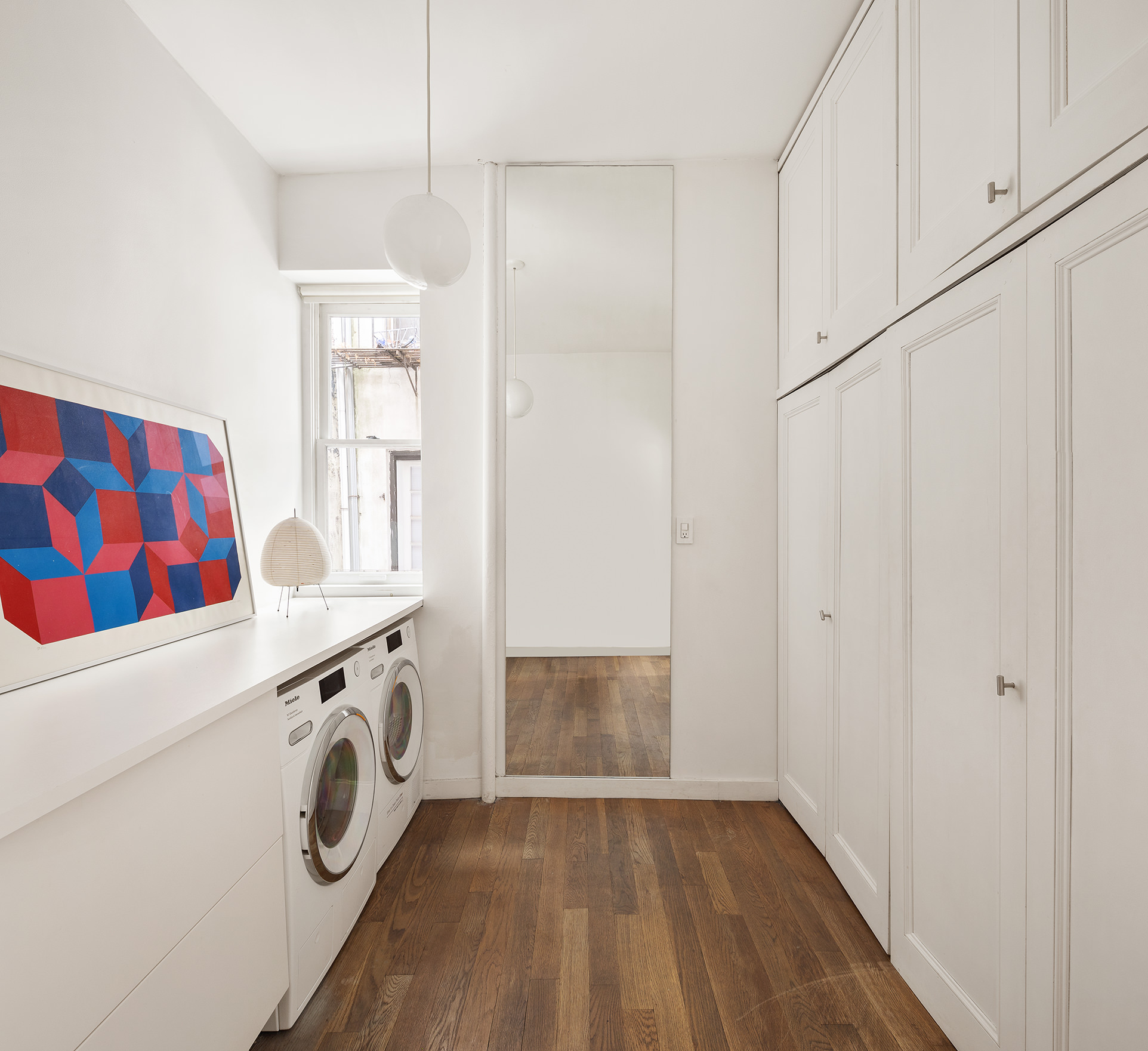 305 East 4th Street, Unit 2 Manhattan, NY 10009 - Photo 4 of 11 a view of utility room with washer and dryer