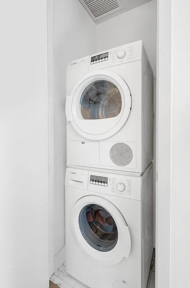 160 East 22nd Street, Unit 4D Manhattan, NY 10010 - Photo 5 of 15 a utility room with dryer and washer