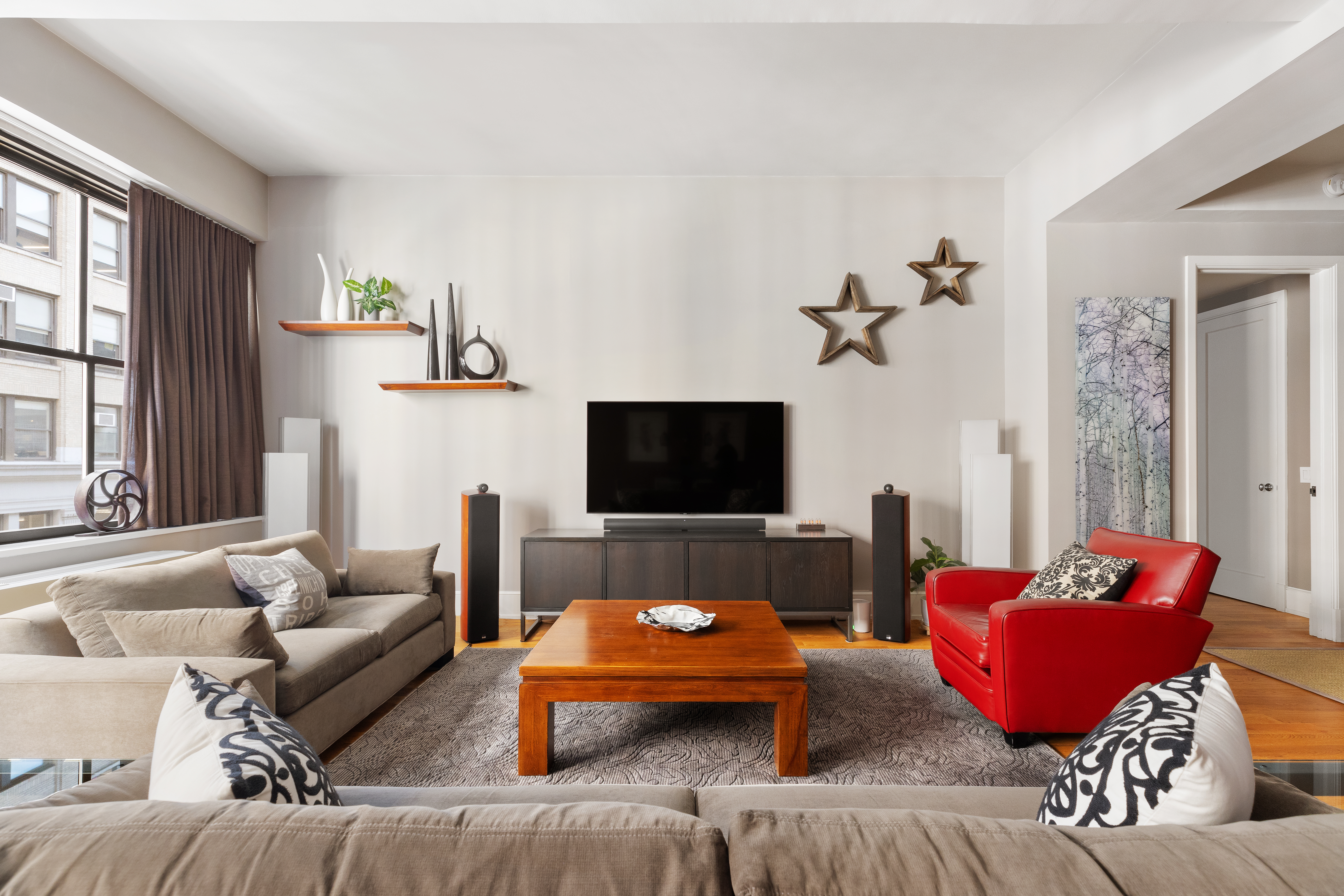 130 West 30th Street, Unit 3B Manhattan, NY 10001 - Photo 2 of 15 a living room with furniture and a flat screen tv