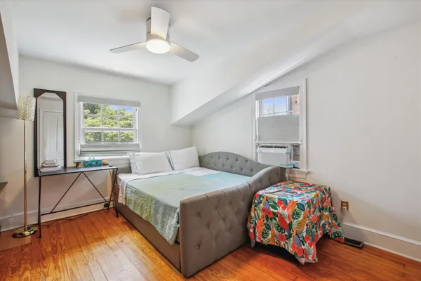 a bedroom with a bed and a table in it