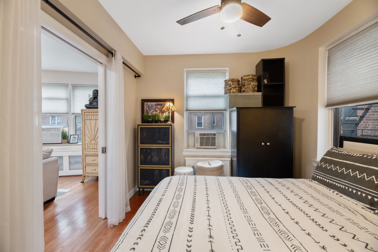 a bedroom with a bed and a view of kitchen