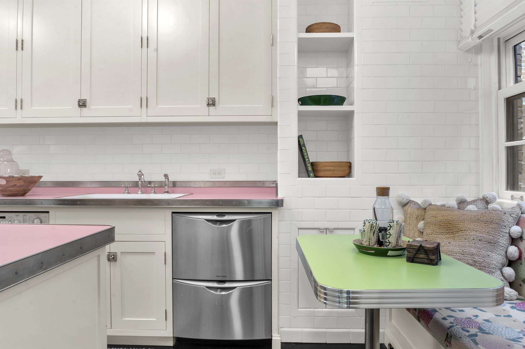 7 Gracie Square, Unit 5A Manhattan, NY 10128 - Photo 20 of 26 a kitchen with a refrigerator and a white cabinets