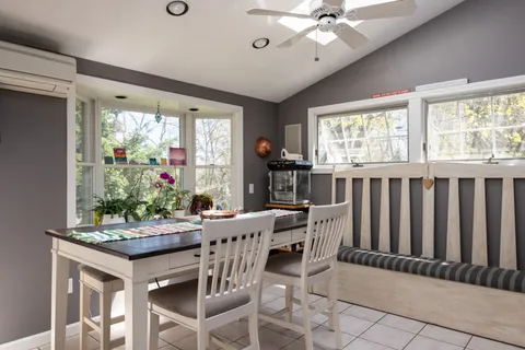a view of a dining room with furniture window and outside view