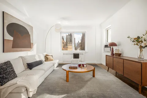 a living room with furniture and window