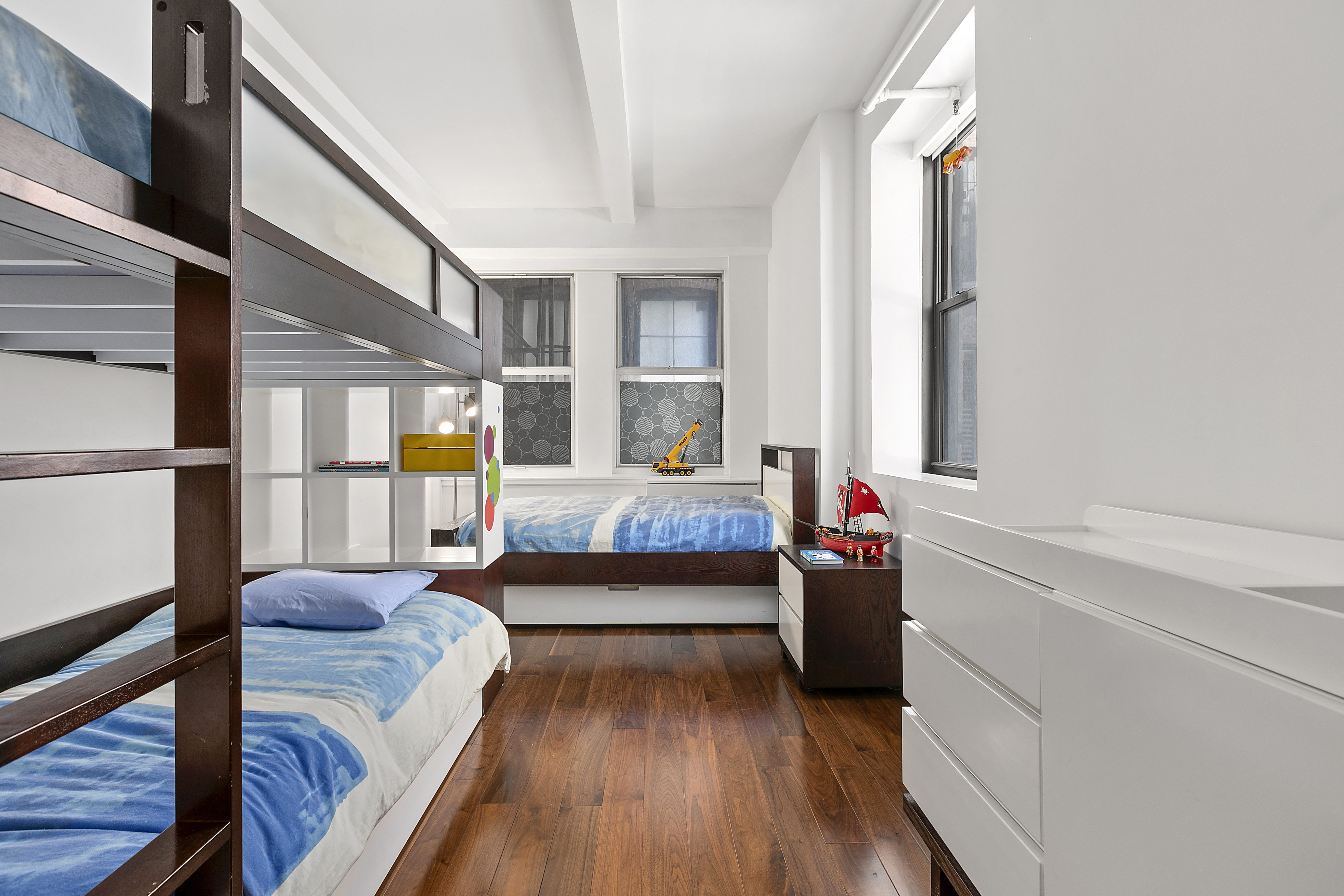 15 West 17th Street, Unit 6 Manhattan, NY 10011 - Photo 8 of 9 a bedroom with furniture and a wooden floor