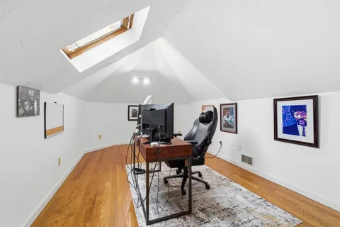 a workspace with furniture and lamp