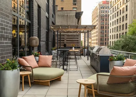 a outdoor space with patio couches and a potted plant