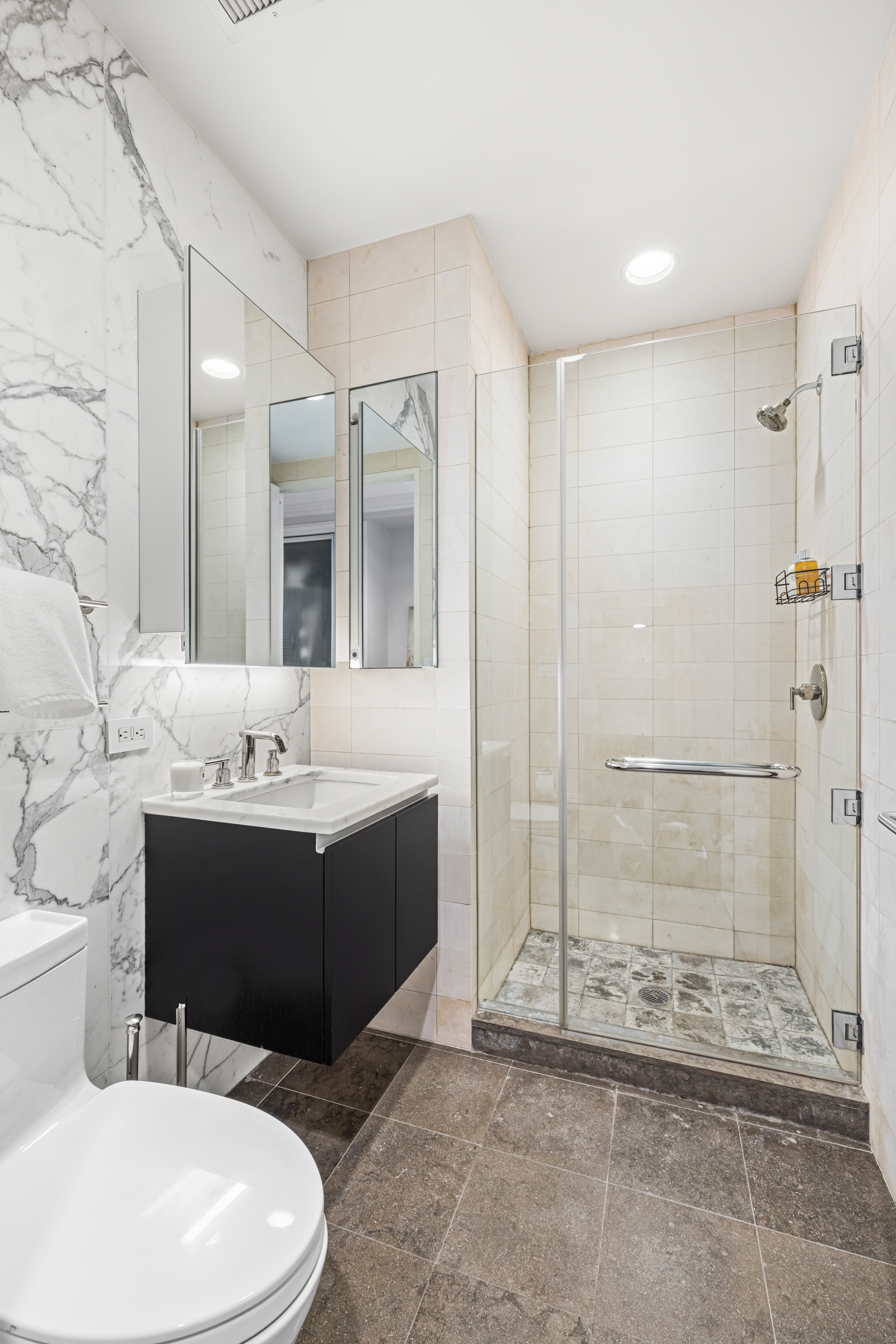 51 Walker Street, Unit 6B Manhattan, NY 10013 - Photo 9 of 10 a bathroom with a sink a toilet and shower