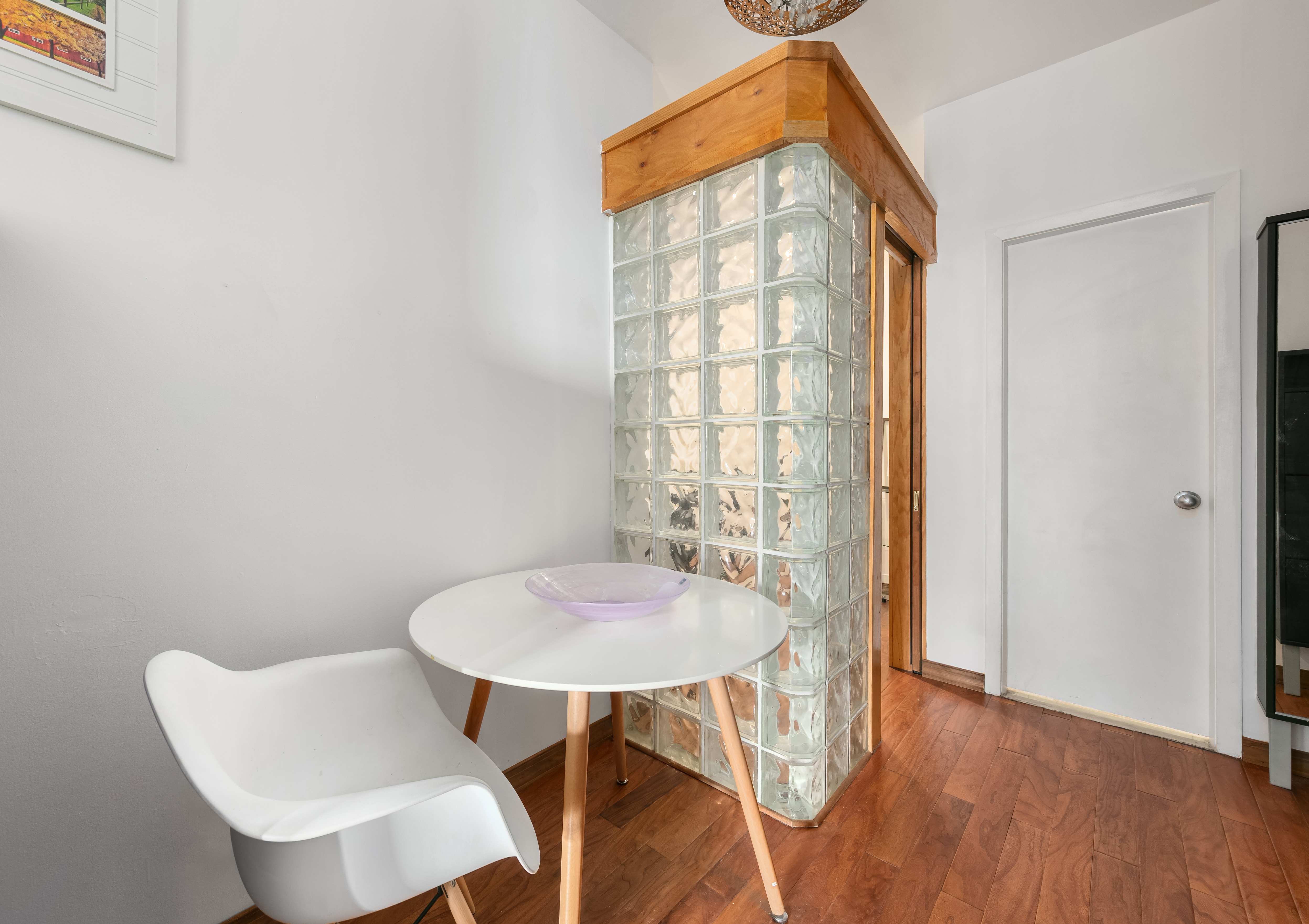3 Hanover Square, Unit 10H Manhattan, NY 10004 - Photo 5 of 9 a view of a dining room with furniture and wooden floor