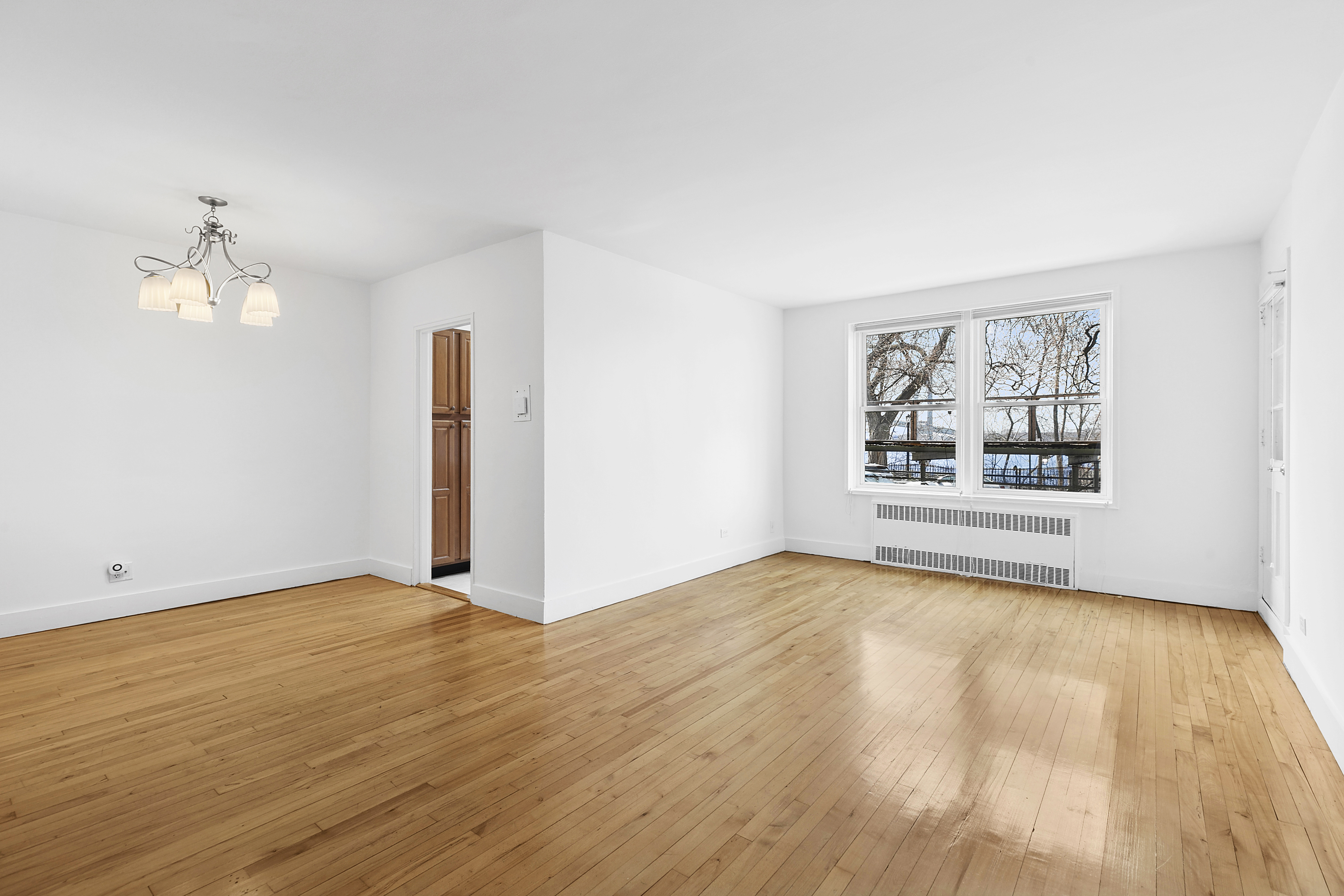 9801 Shore Road, Unit 1K Brooklyn, NY 11209 - Photo 4 of 11 a view of an empty room with a window