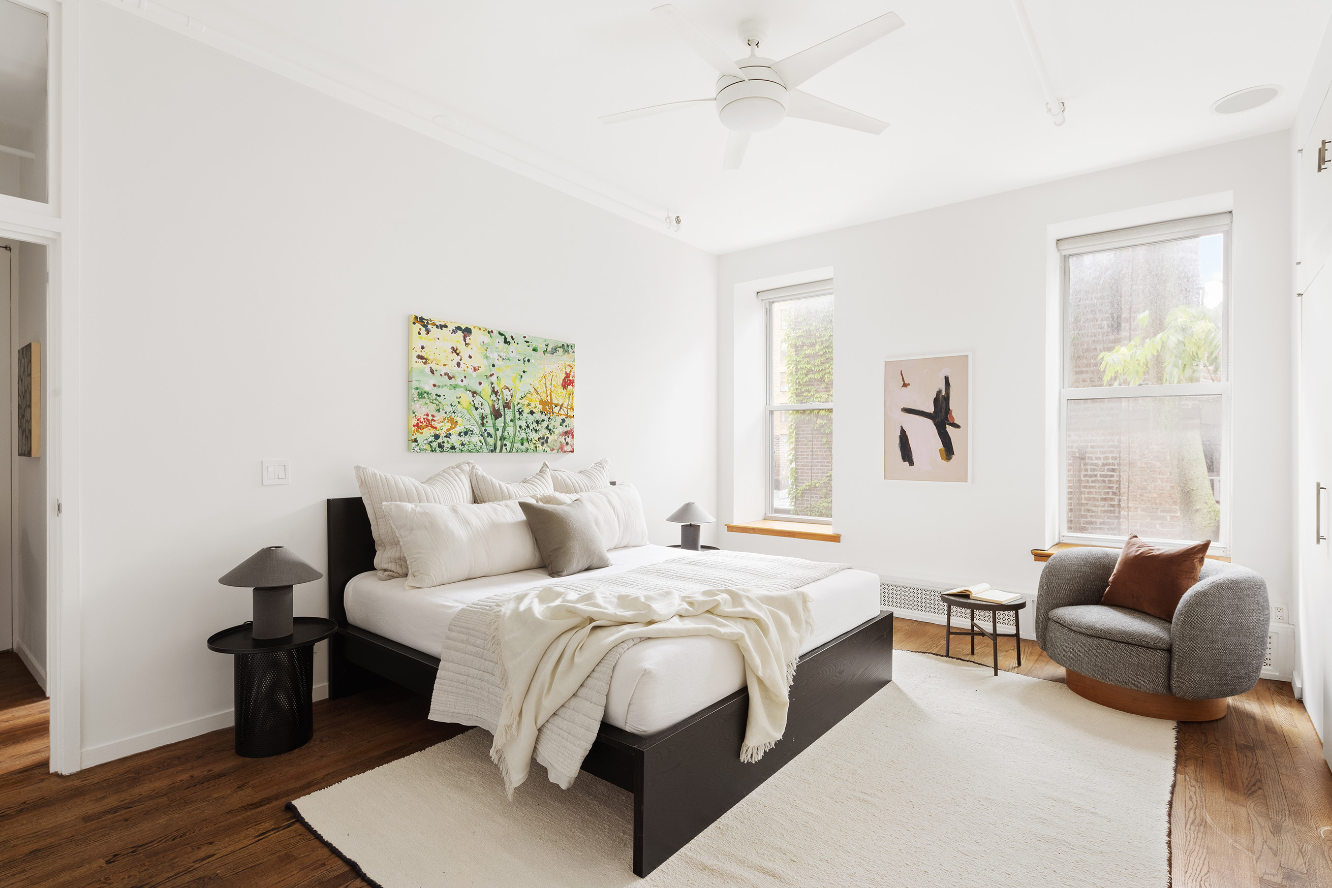 214 West 17th Street, Unit 4B Manhattan, NY 10011 - Photo 7 of 10 a bedroom with a bed couch and a window