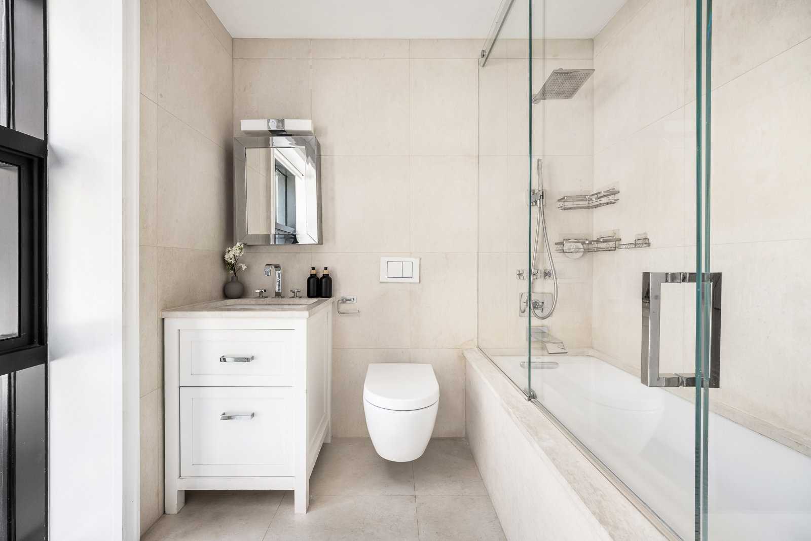 137 Franklin Street, Unit 1 Manhattan, NY 10013 - Photo 22 of 25 a bathroom with a sink a toilet and shower