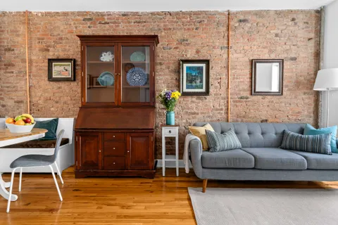 a living room with furniture and a rug