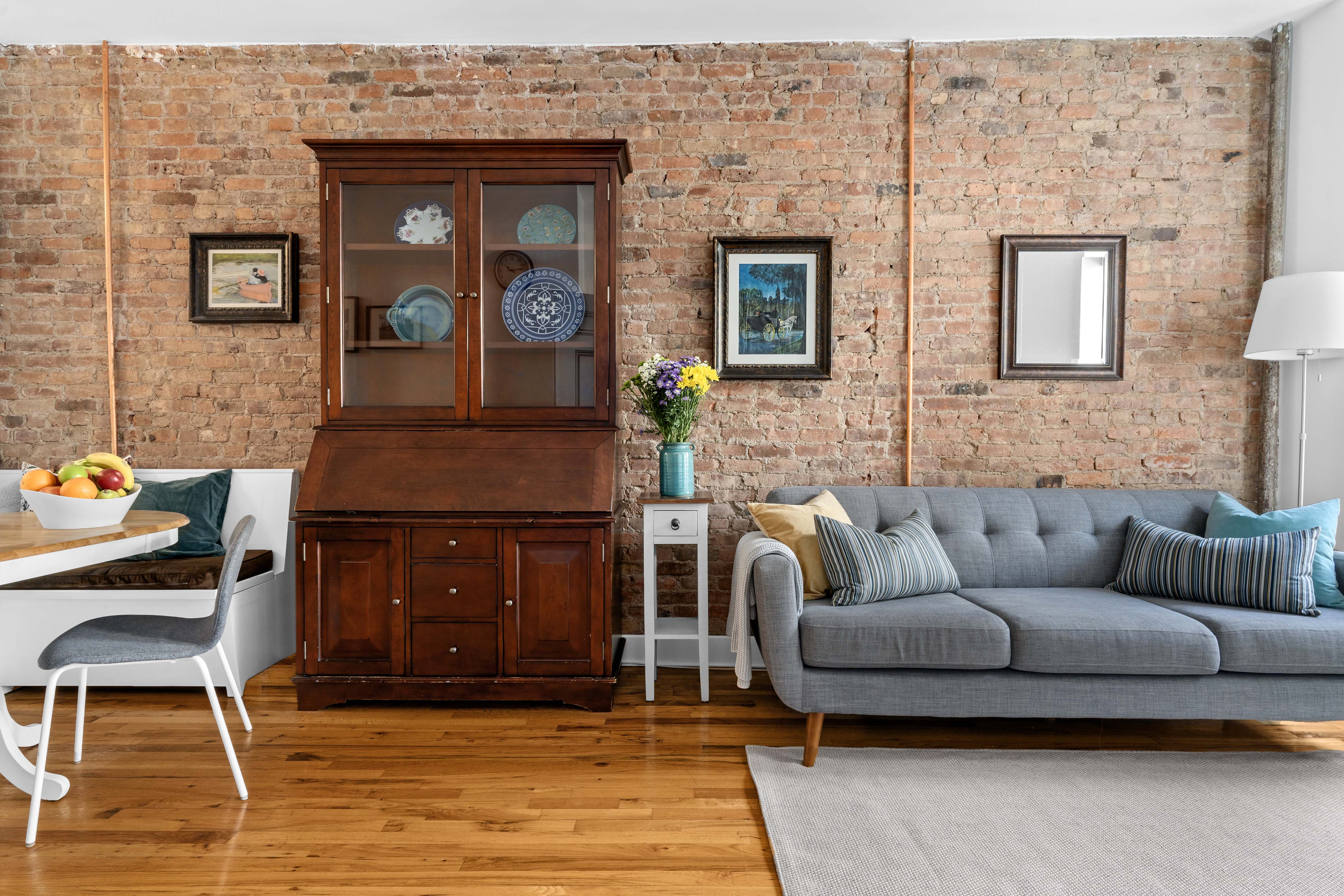 456 15th Street, Unit 1R Brooklyn, NY 11215 - Photo 3 of 14 a living room with furniture and a rug