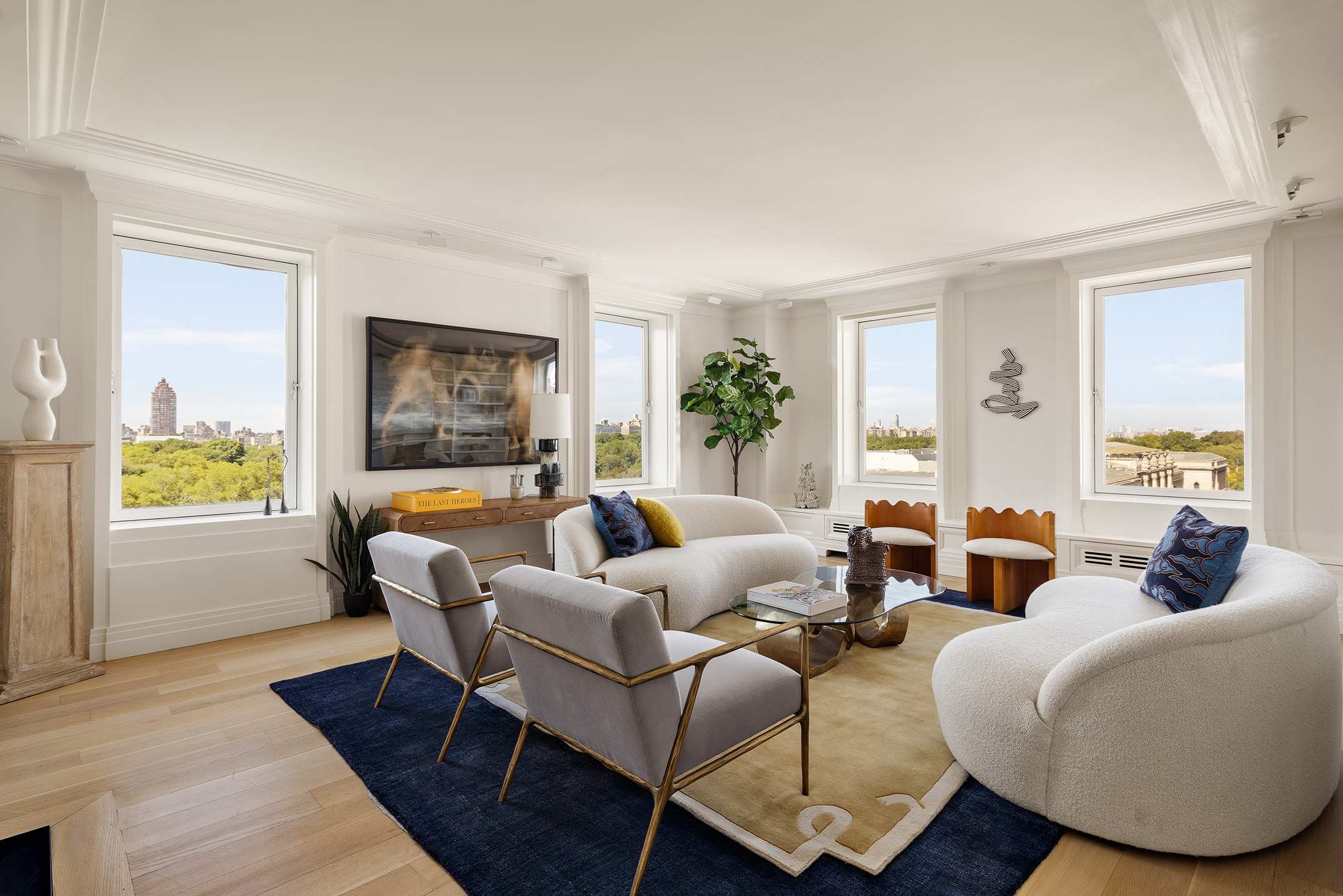 a living room with furniture wooden floor and window