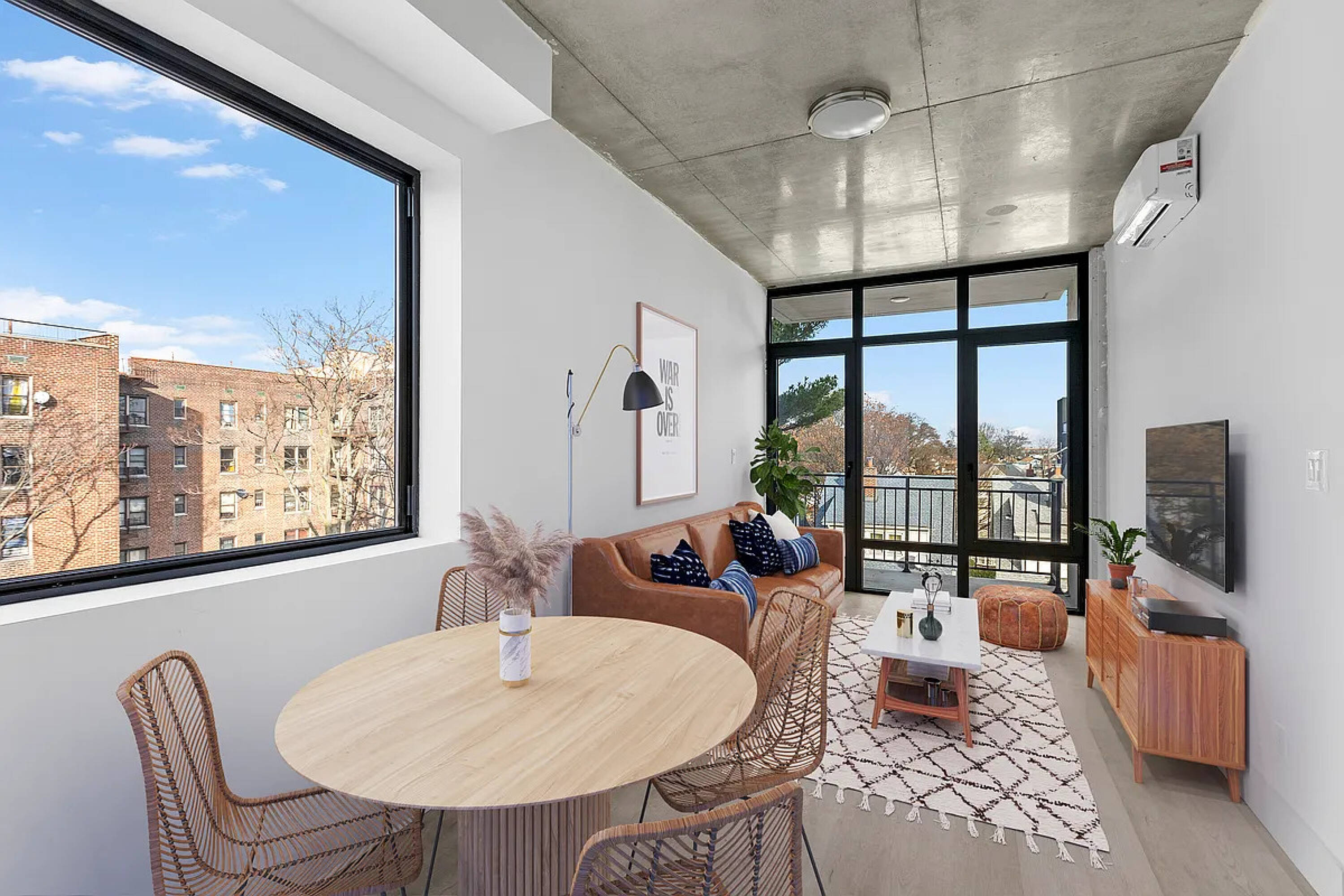 485 East 28th Street Brooklyn, NY 11226 - Photo 7 of 17 a living room with furniture and a flat screen tv
