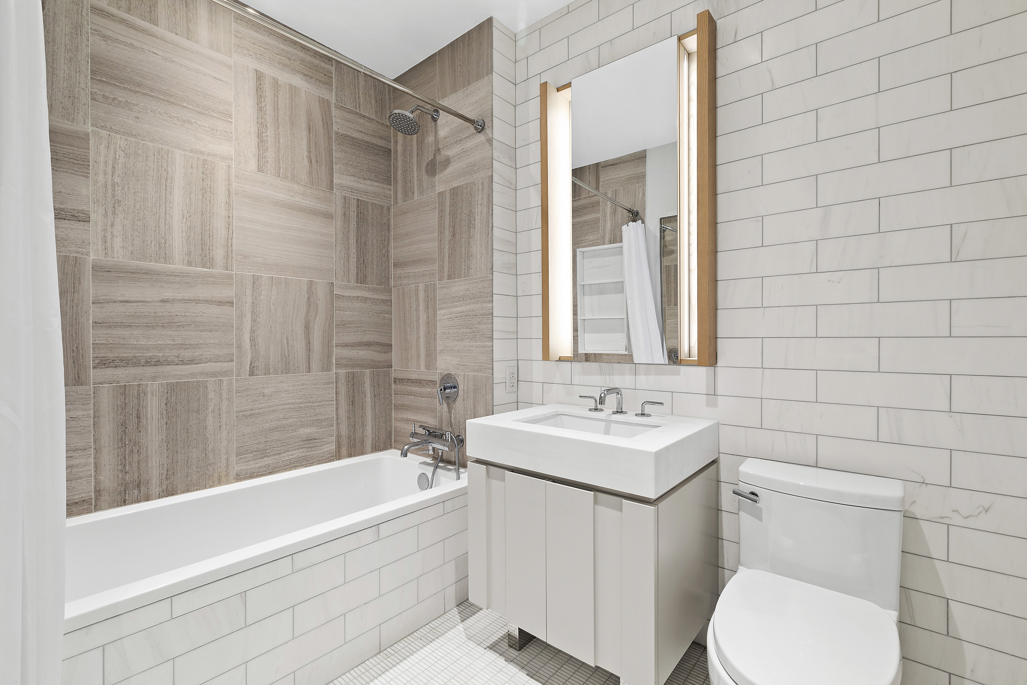 22-18 Jackson Avenue, Unit 209 Queens, NY 11101 - Photo 5 of 14 a bathroom with a sink toilet and shower