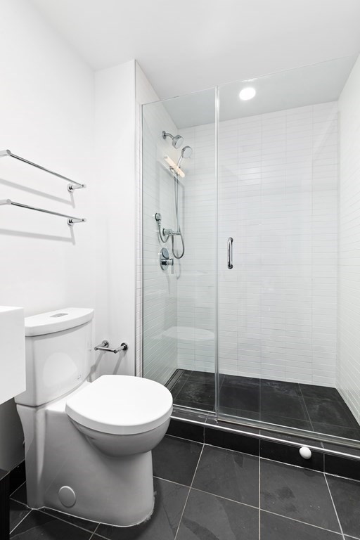319 A Street, Unit 211 Boston, MA 02210 - Photo 14 of 24 a bathroom with a toilet and a shower
