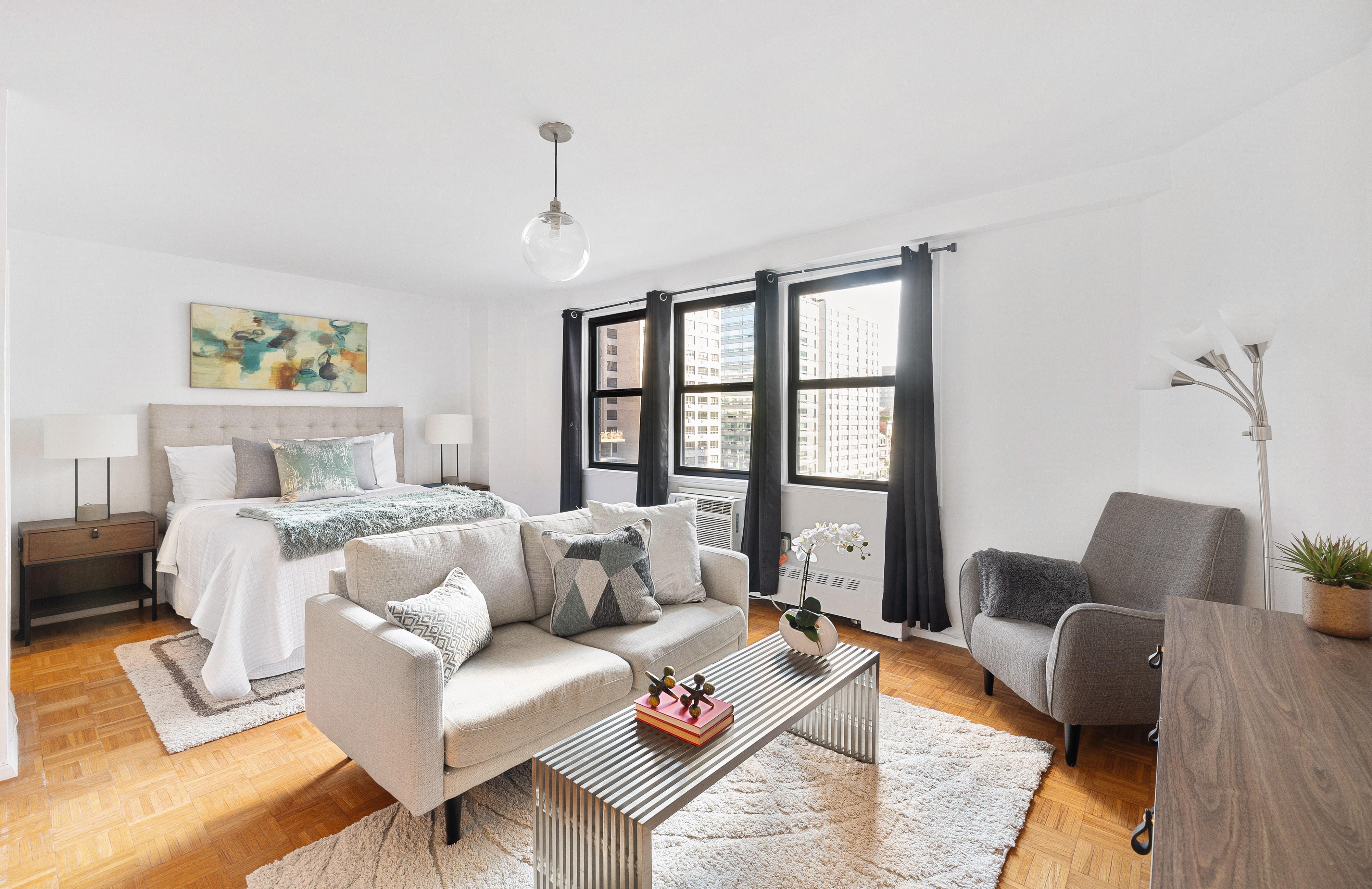 145 East 15th Street, Unit 7C Manhattan, NY 10003 - Photo 1 of 10 a living room with furniture rug and window