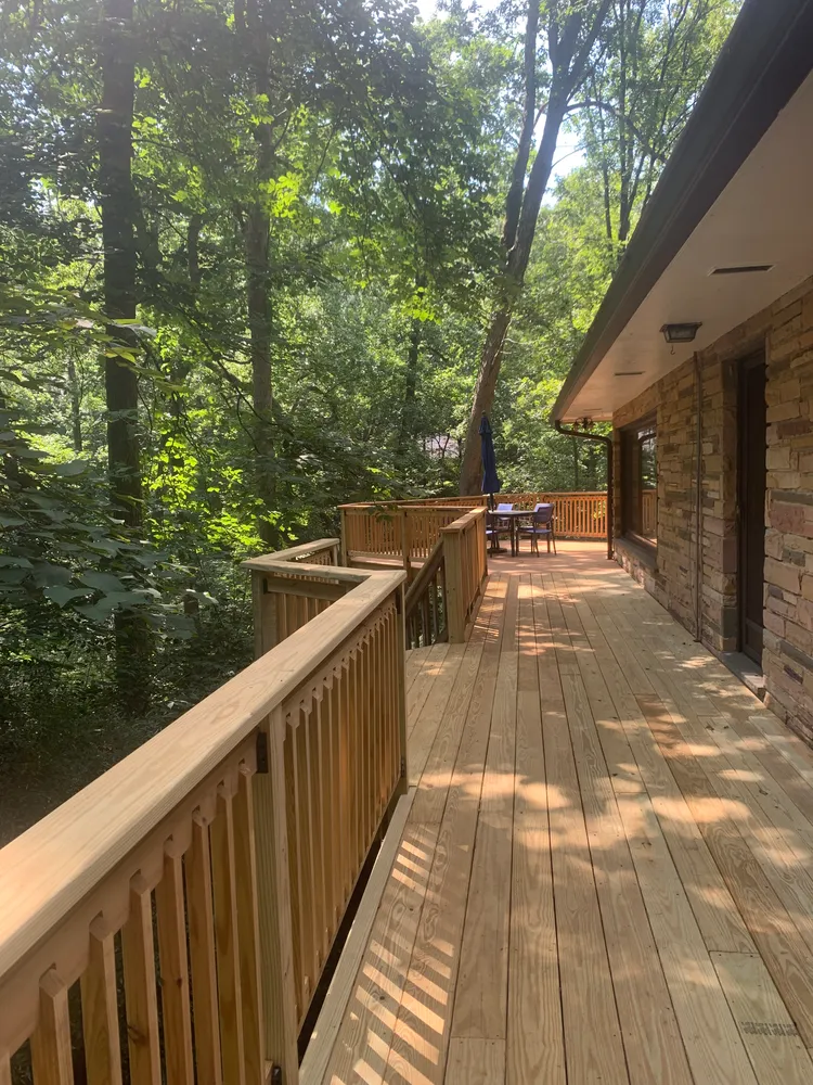 a view of balcony with wooden floor and outdoor space