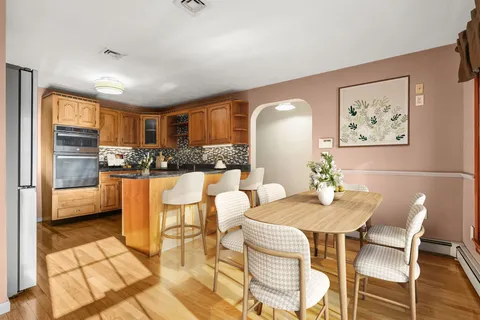 a view of kitchen with cabinets and wooden floor