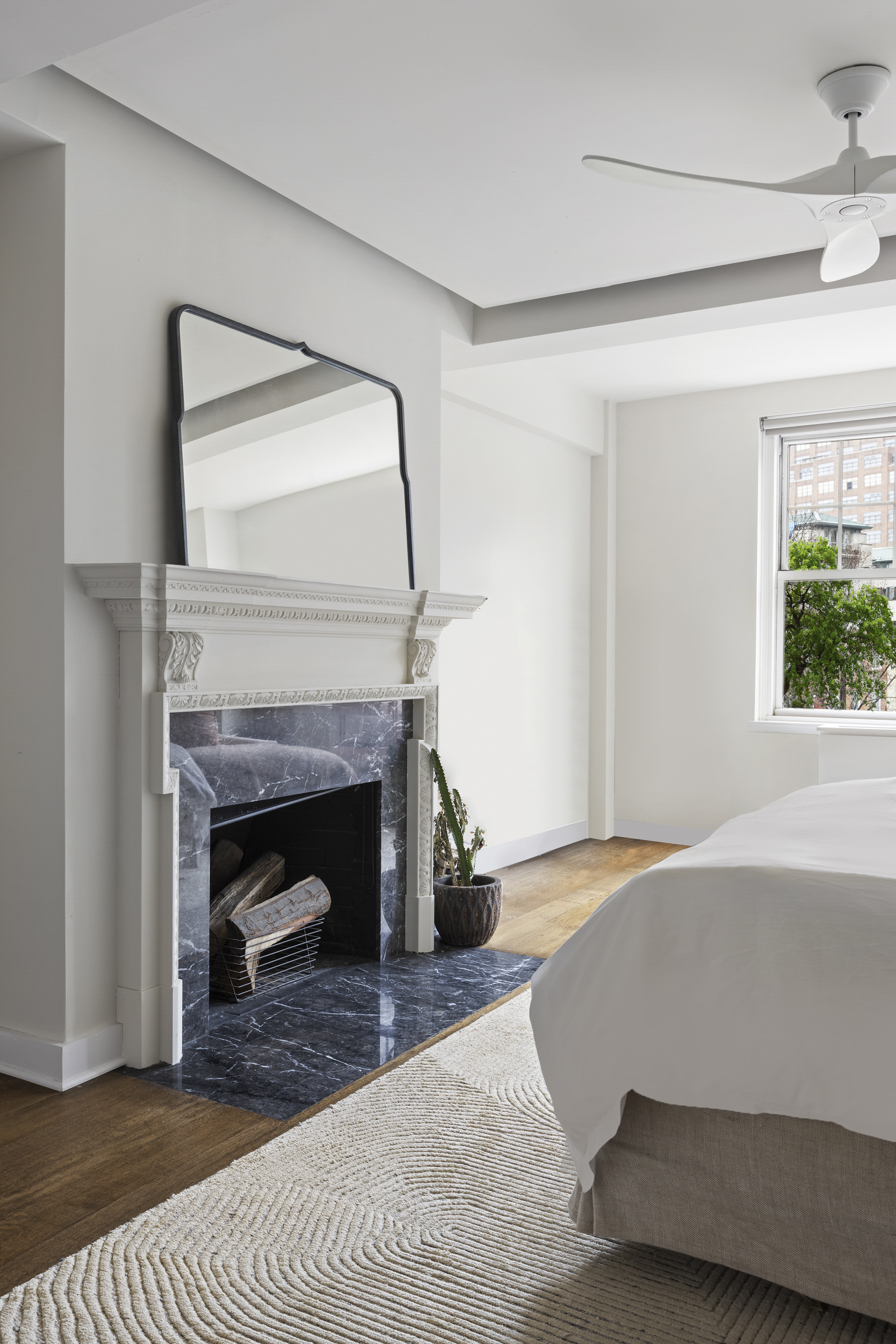 2 Horatio Street, Unit 4JS Manhattan, NY 10014 - Photo 14 of 20 a bedroom with a bed and a fireplace