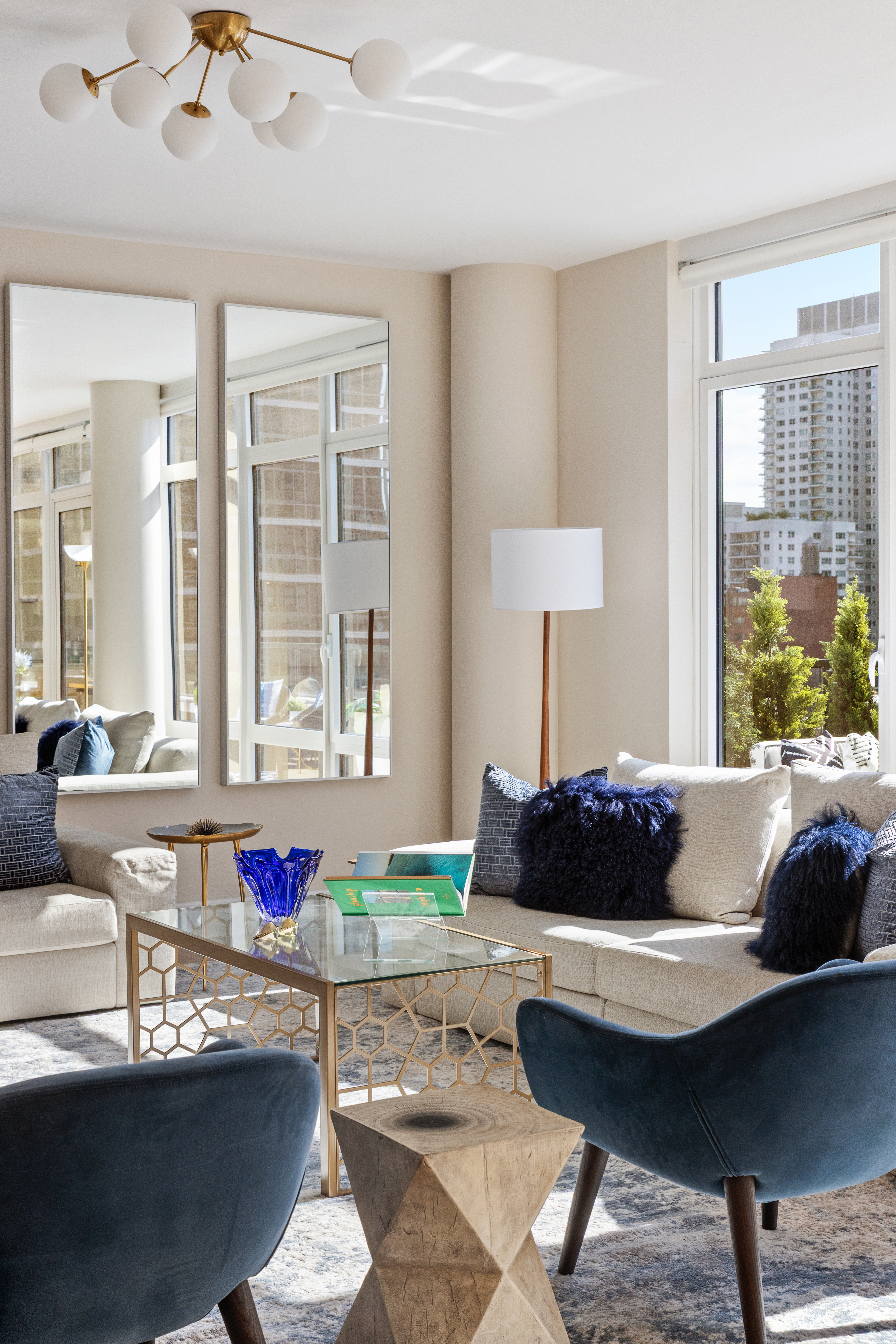 1355 1st Avenue, Unit 8 Manhattan, NY 10021 - Photo 12 of 25 a living room with furniture and a large window