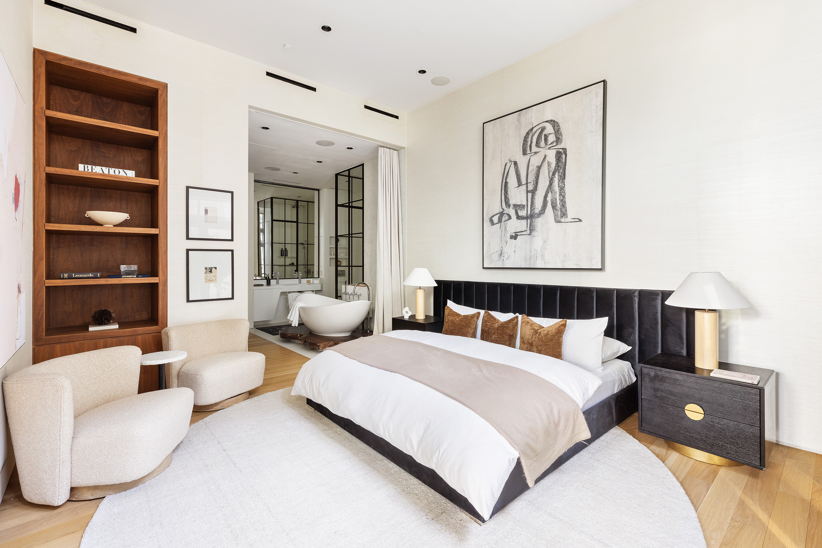 166 Perry Street, Unit 1C Manhattan, NY 10014 - Photo 9 of 18 a bedroom with a bed couch and a view of kitchen