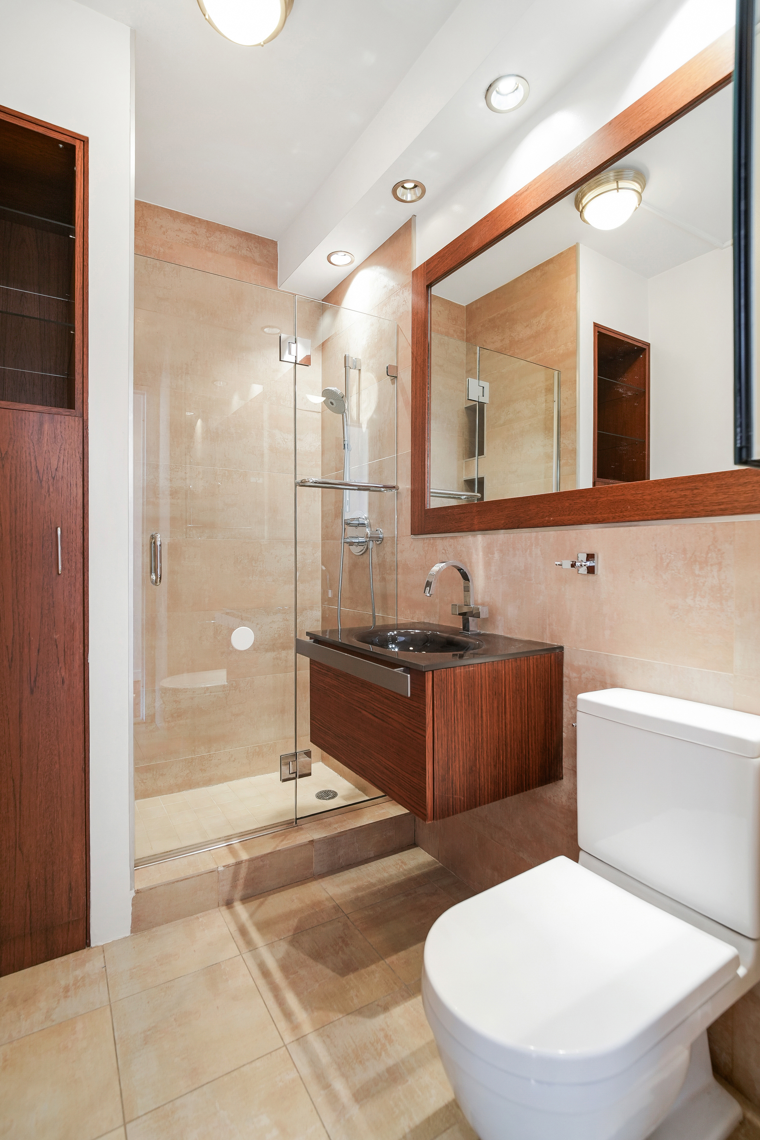 360 East 88th Street, Unit 34A Manhattan, NY 10128 - Photo 11 of 35 a bathroom with a granite countertop toilet a sink and bathtub