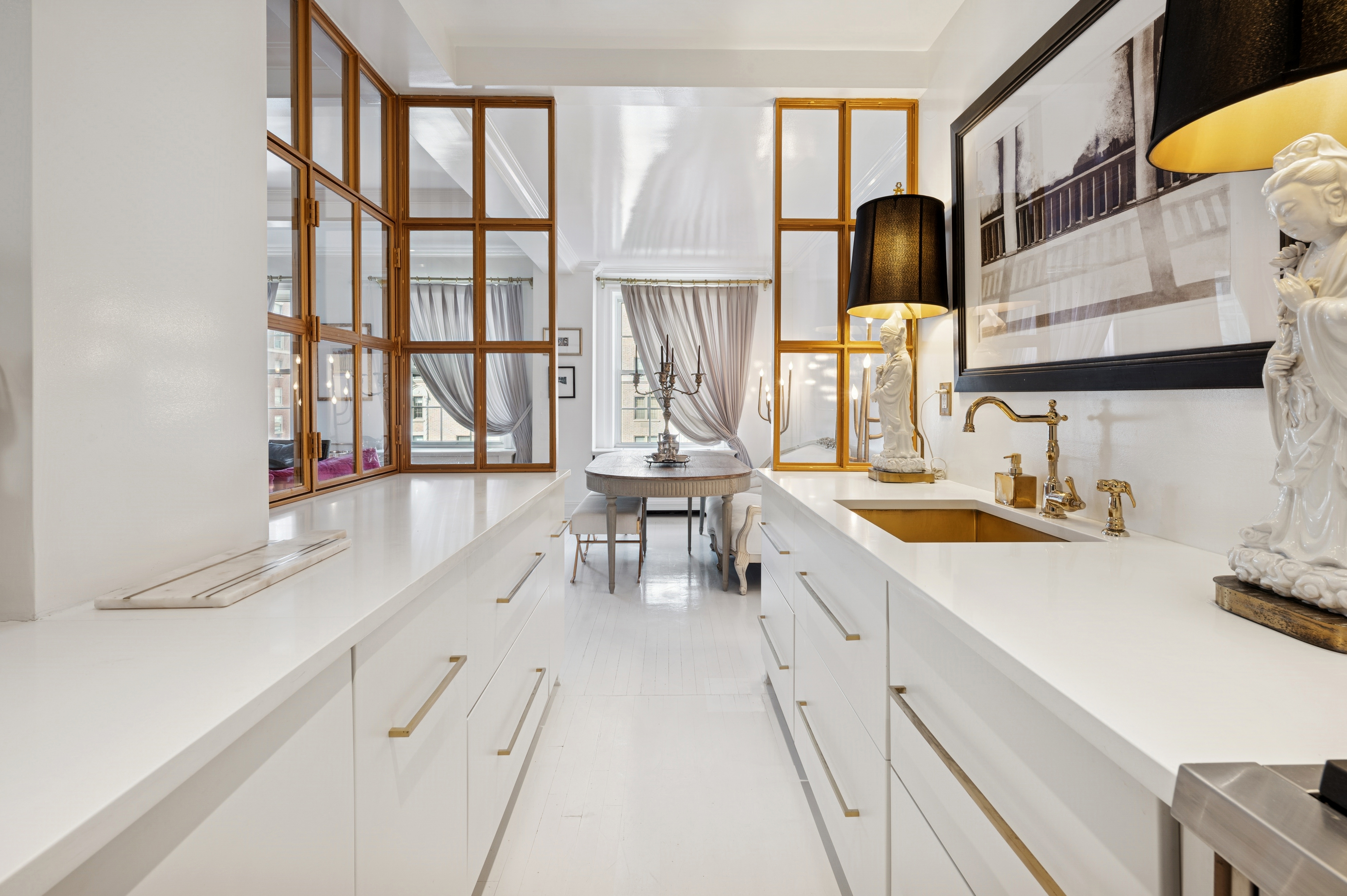 891 Park Avenue, Unit 10 Manhattan, NY 10075 - Photo 9 of 27 a kitchen with granite countertop a sink a counter top space and cabinets