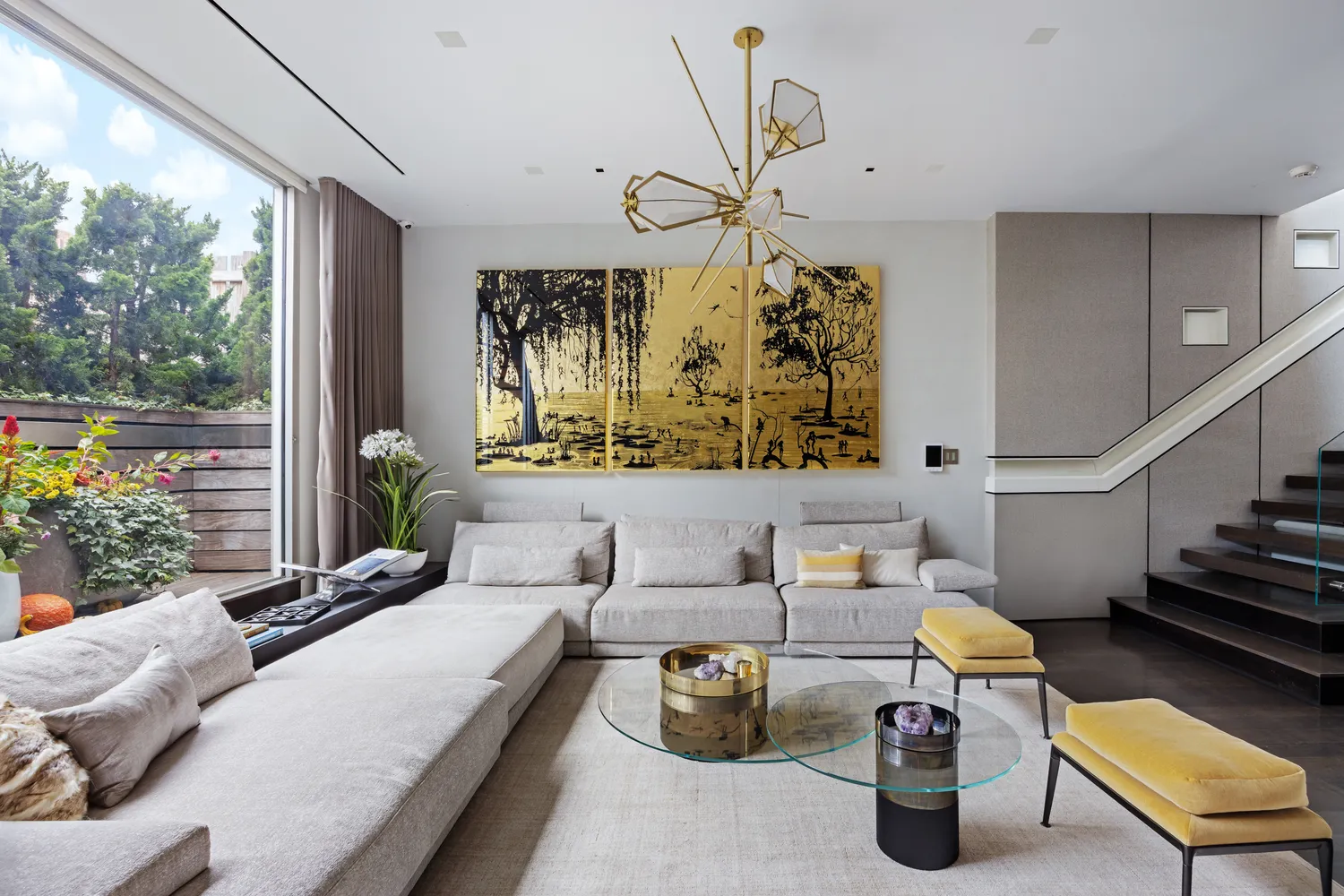 a bedroom with furniture and a large window