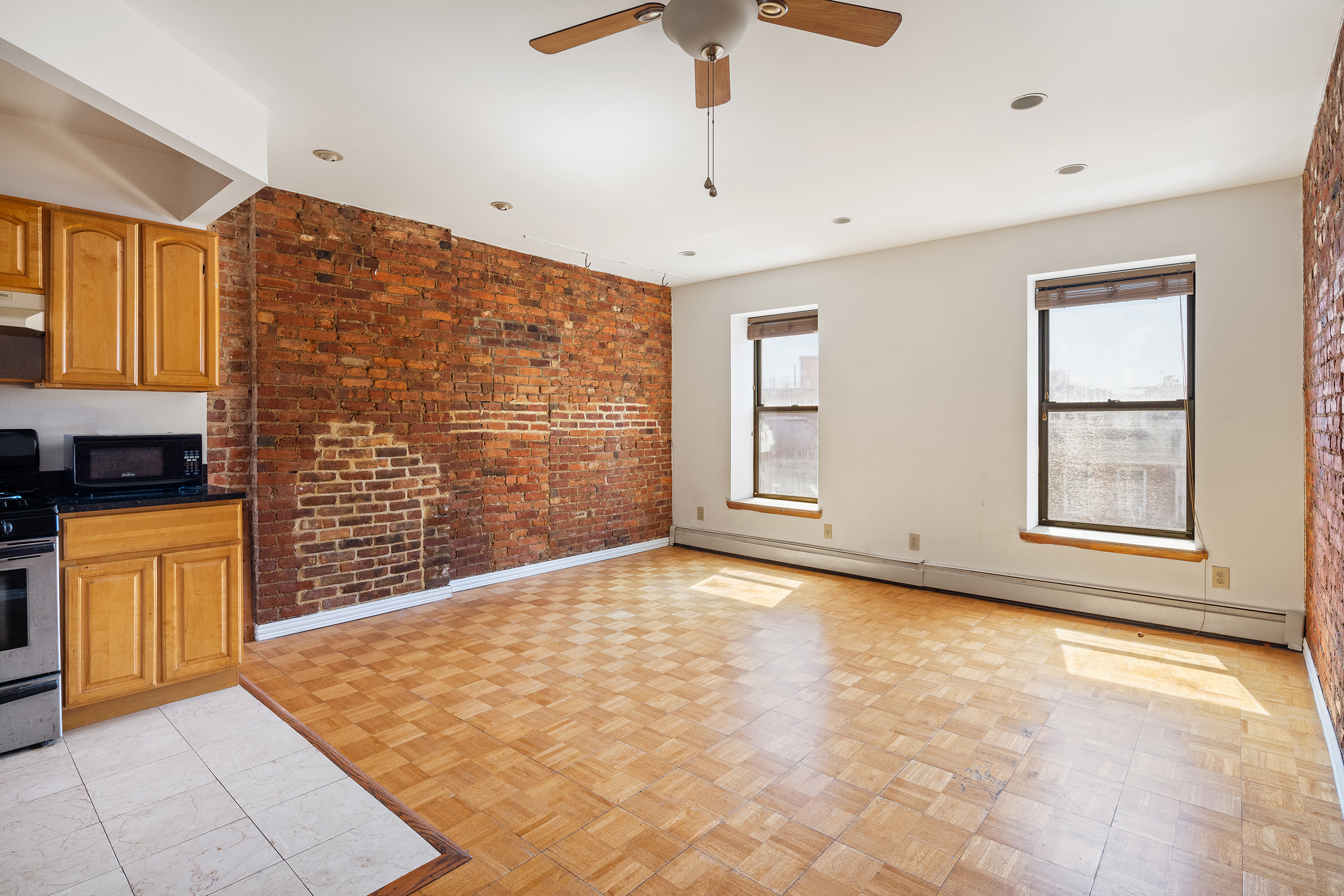 37 Quincy Street Brooklyn, NY 11238 - Photo 15 of 24 a view of an empty room with a kitchen