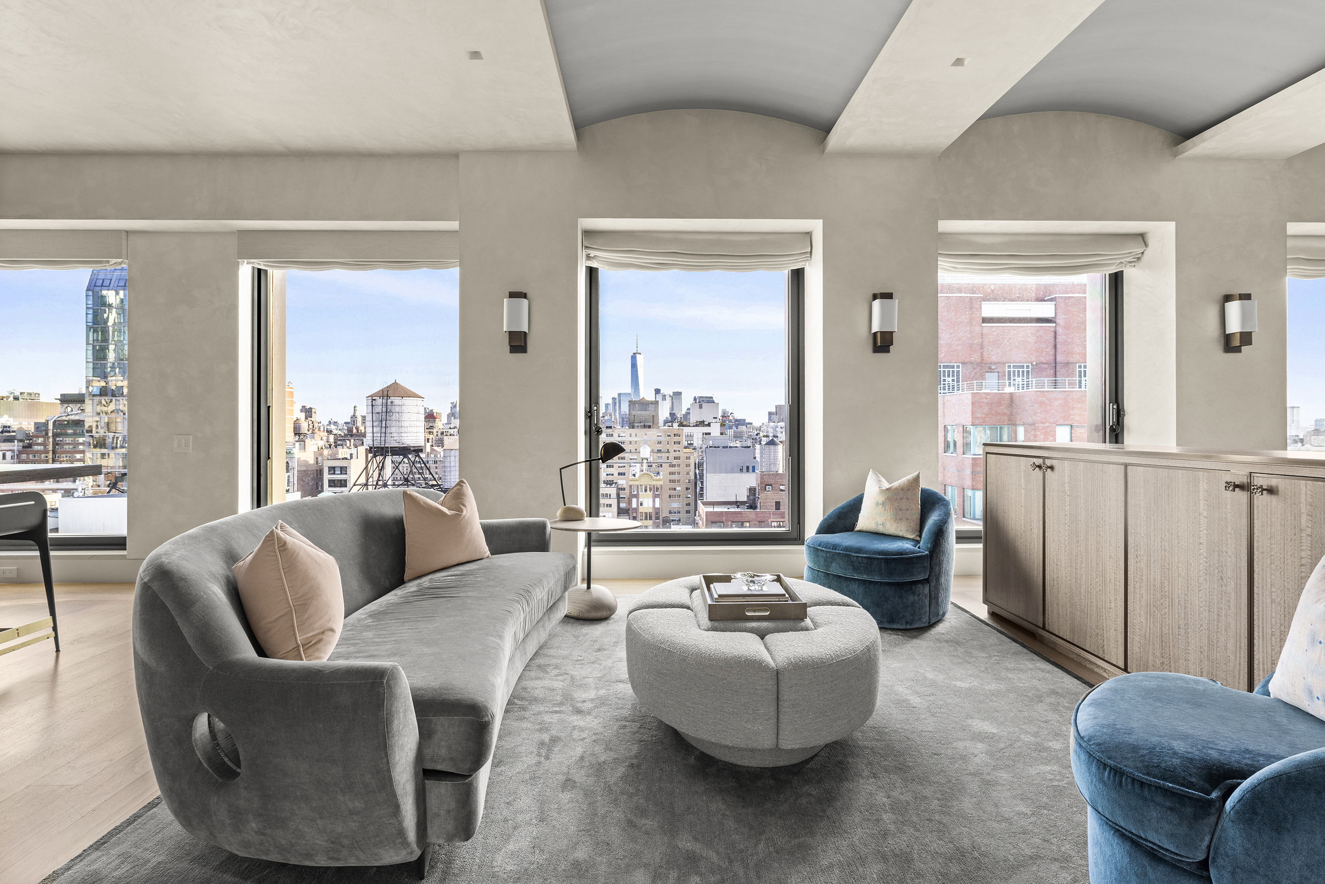 55 West 17th Street, Unit PH Manhattan, NY 10011 - Photo 5 of 36 a living room with furniture and a large window
