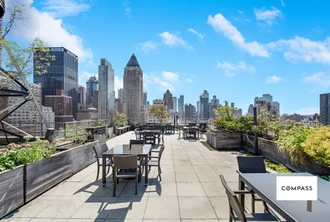 a view of a terrace with sitting area