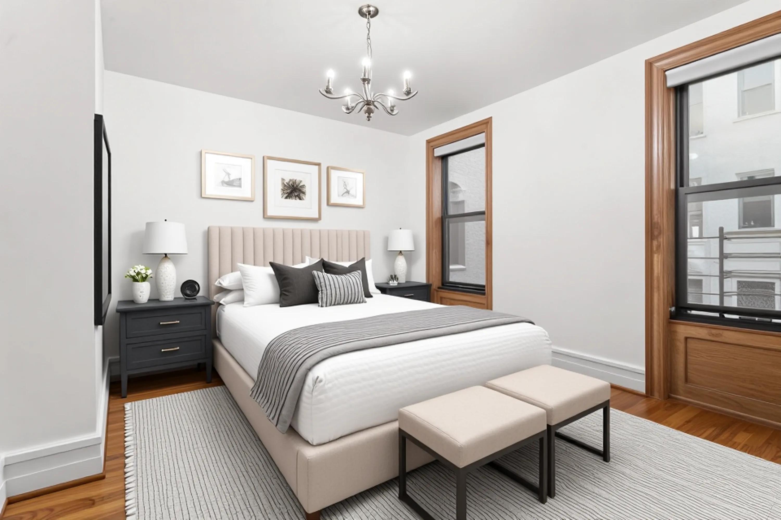 527 West 143rd Street, Unit 31 Manhattan, NY 10031 - Photo 11 of 29 a spacious bedroom with a bed and wooden floor
